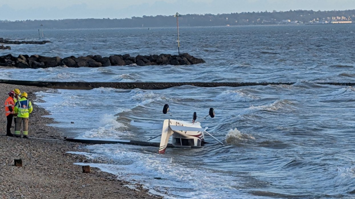 British beachgoers horrified as plane crashes in front of them and pilot 'crawls from wreckage'