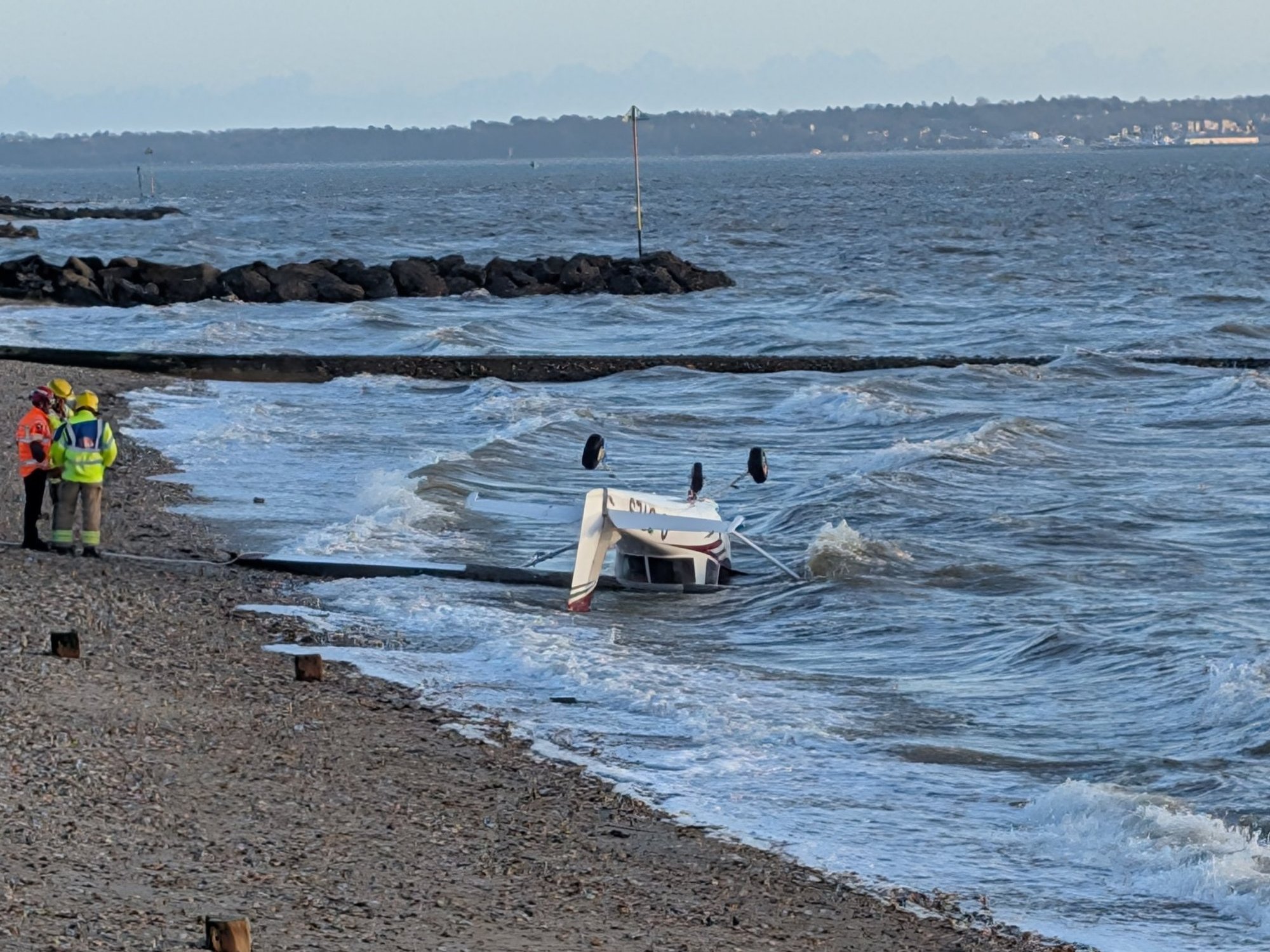 British beachgoers horrified as plane crashes in front of them and pilot 'crawls from wreckage'