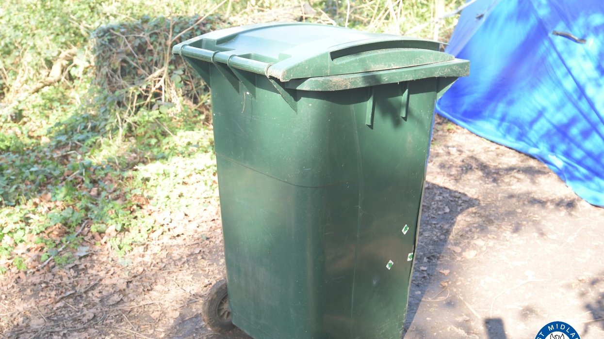 Three arrested after man's body found in green wheelie bin