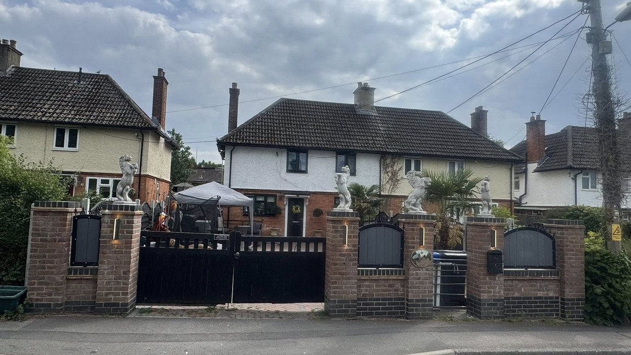 Neighbour row erupts after travellers built wall topped with giant horse statues and accuse locals of 'not liking Gypsies'