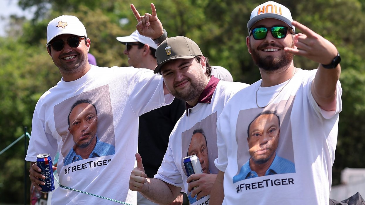Golf fans seen wearing shirts of Tiger Woods mugshot during tournament after legend's arrest