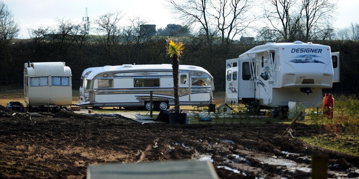 ANOTHER traveller invasion strikes leafy village as cascade of caravans roll in over Easter ANOTHER traveller invasion strikes leafy village as cascade of caravans roll in over Easter