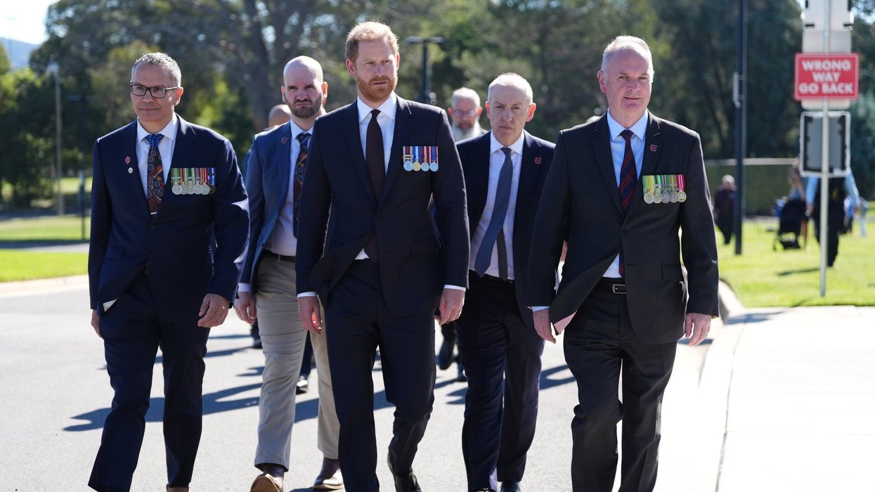 Prince Harry takes part in Aboriginal smoking ceremony as Meghan Markle absent
