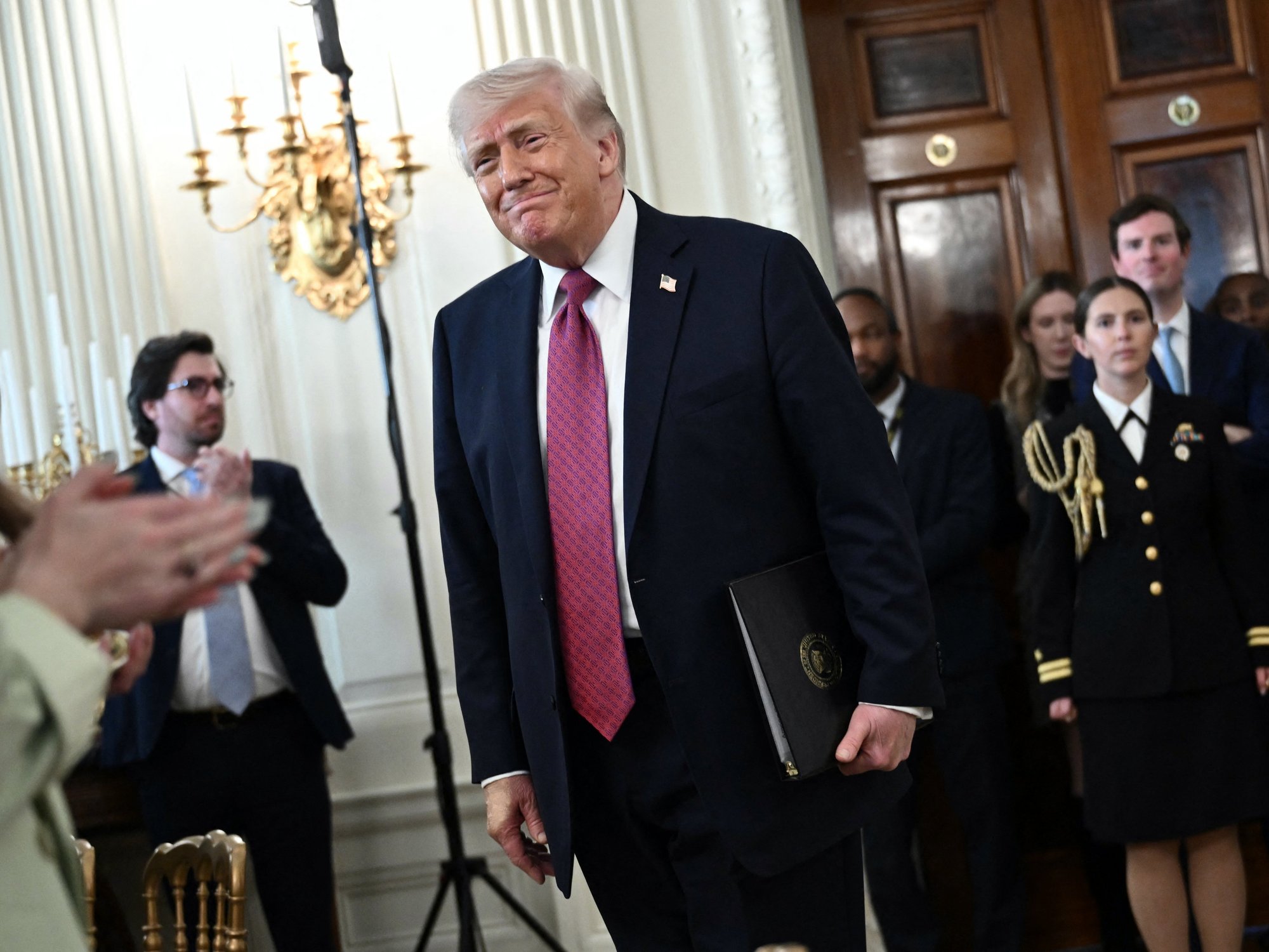 Donald Trump in awkward moment with American students after bragging about banning trans athletes