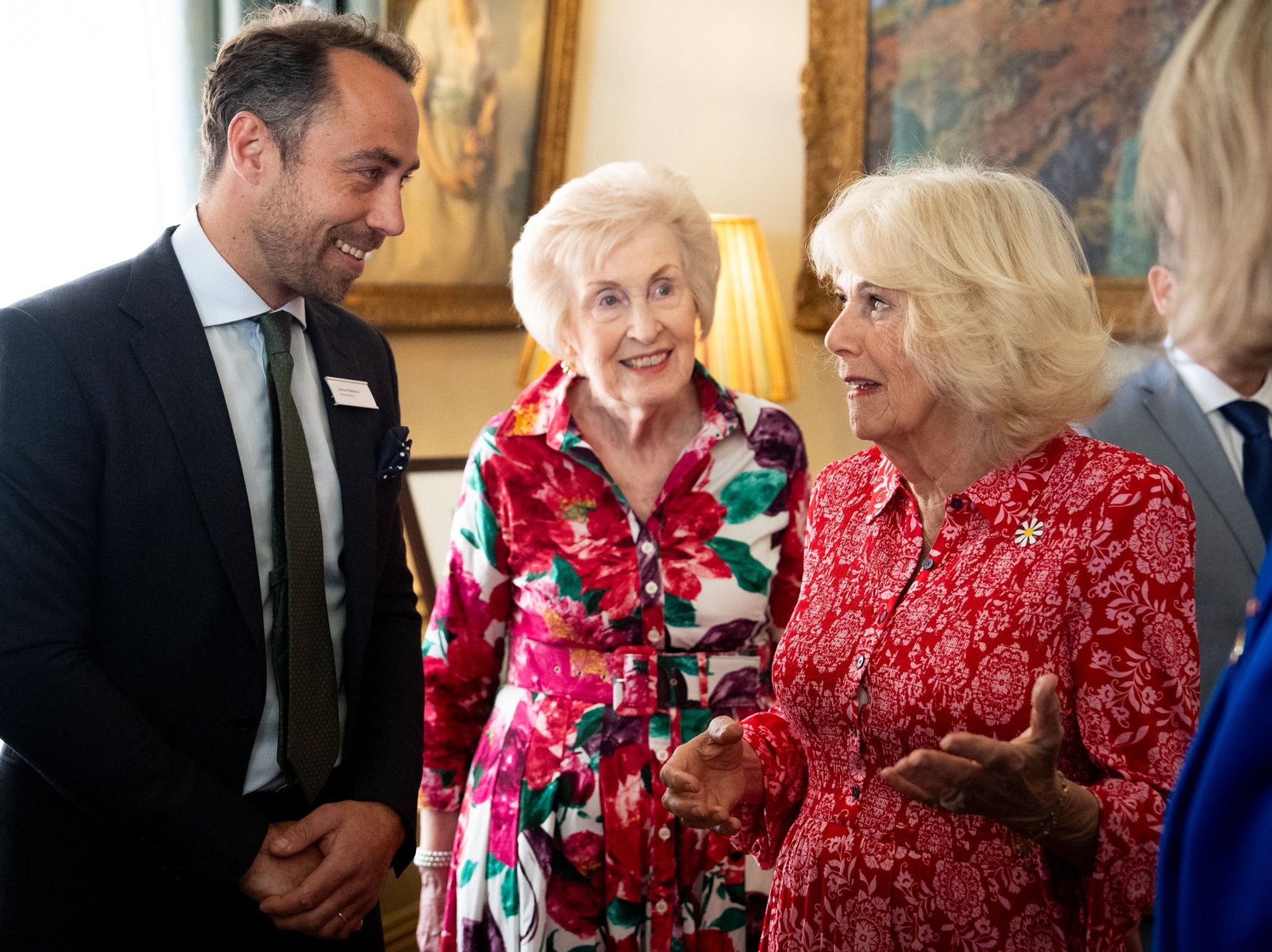 Queen Camilla chats with the Princess of Wales's brother James Middleton during reception at roya...