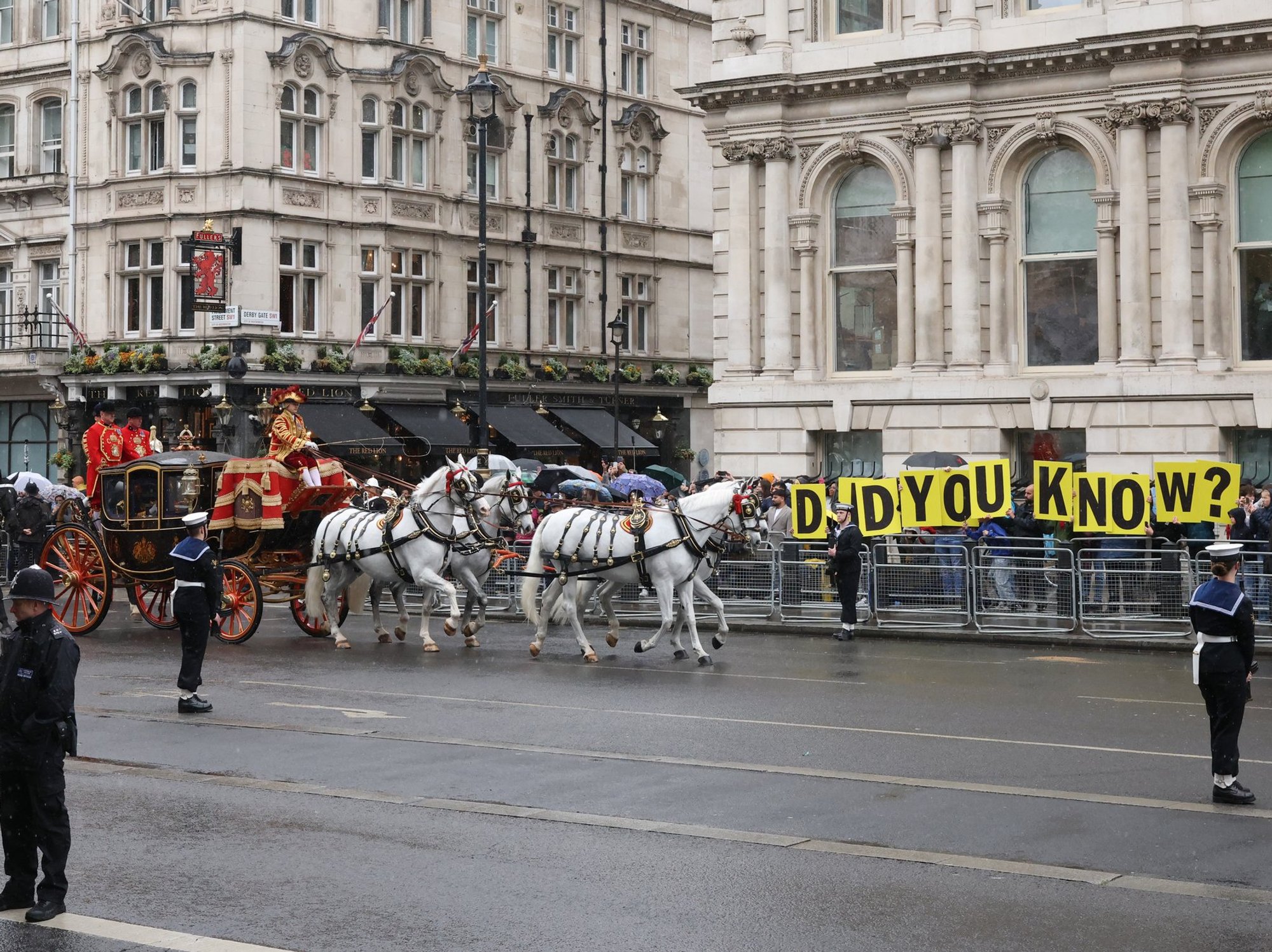King Charles and Queen Camilla met with protests regarding Andrew Mountbatten-Windsor on route to...