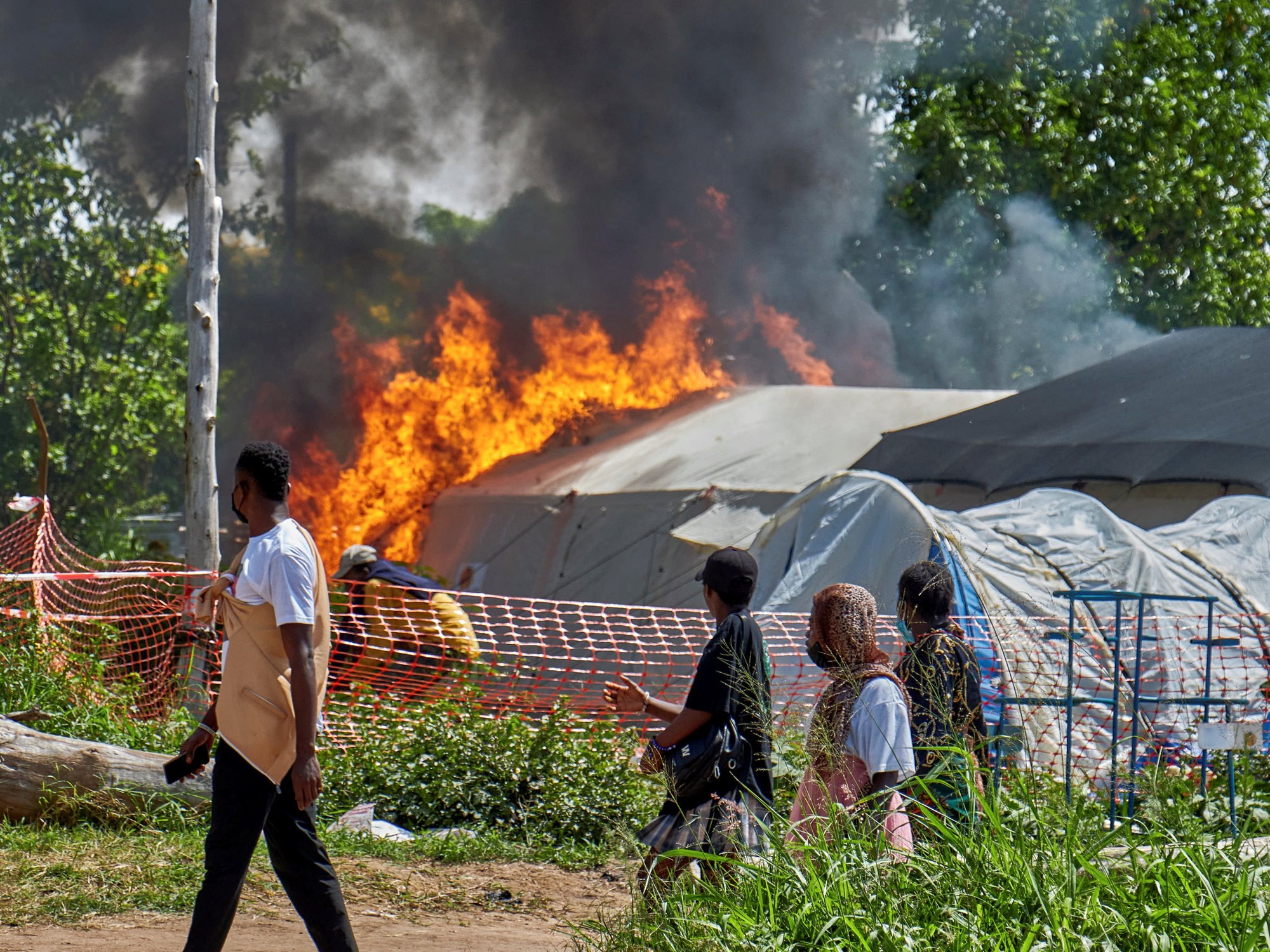 Locals set Ebola clinics on FIRE and reject aid for 'magic' amid panic over 'phantom coffin that ...
