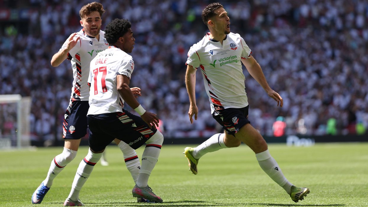 Bolton secure Championship promotion as own goal, overhead kick and hair pull sinks Stockport