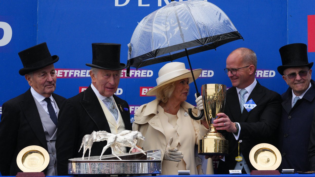 King and Queen hand out prestigious trophy at Epsom just hours after watching Peter Phillips wedding