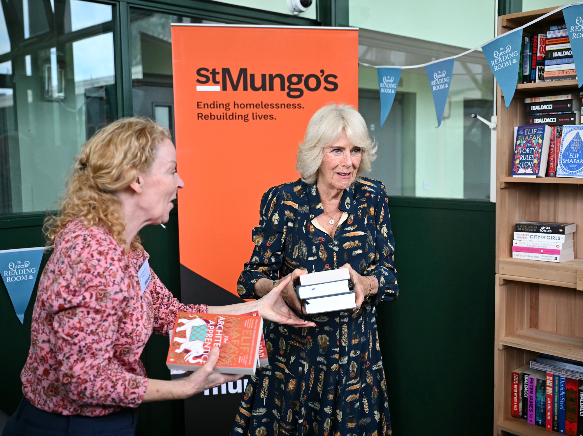 Queen Camilla unveils bookshelves containing her favourite titles