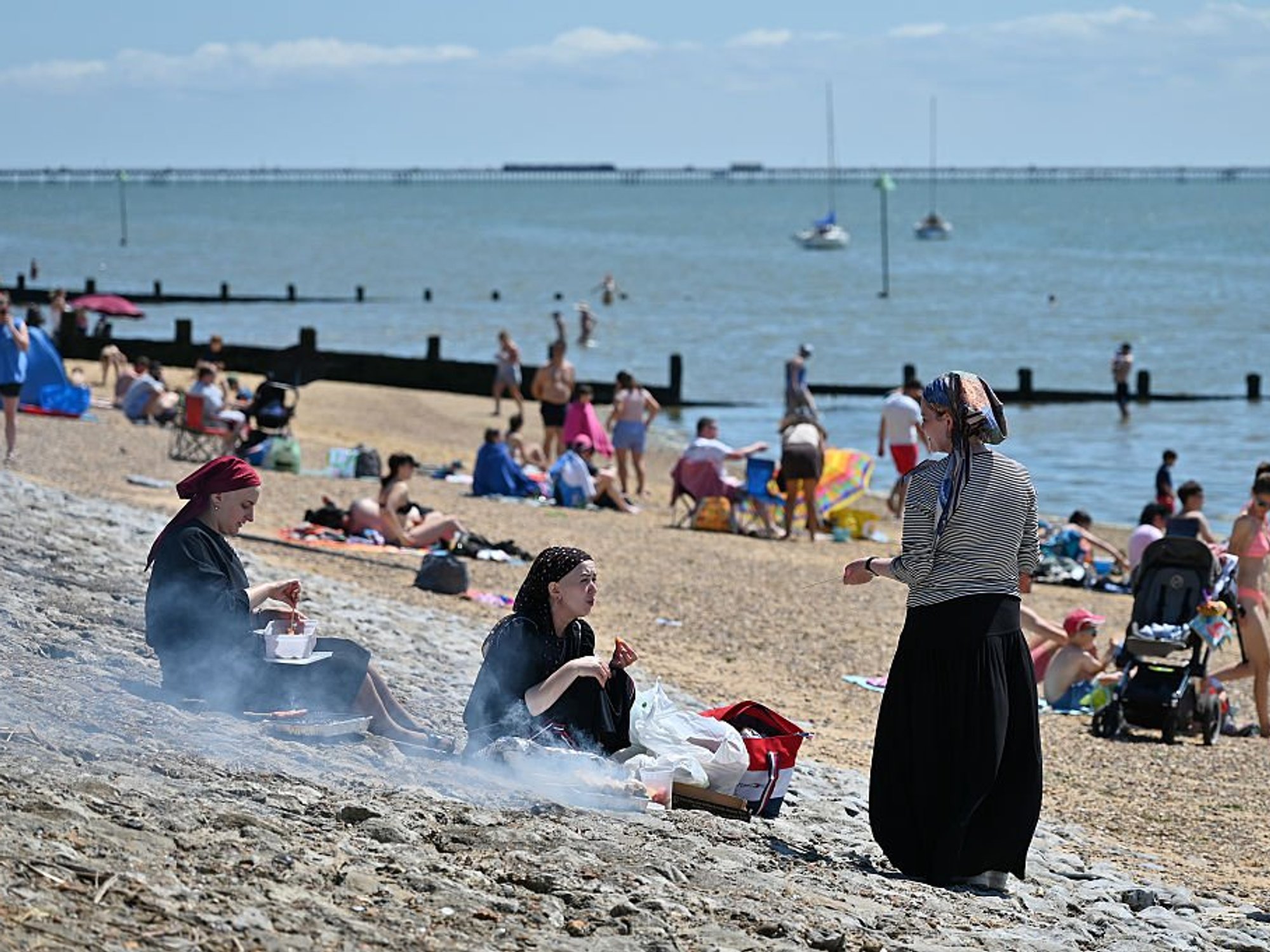 Britons warming up for summer’s first BBQ weekend as thunder and rain give way