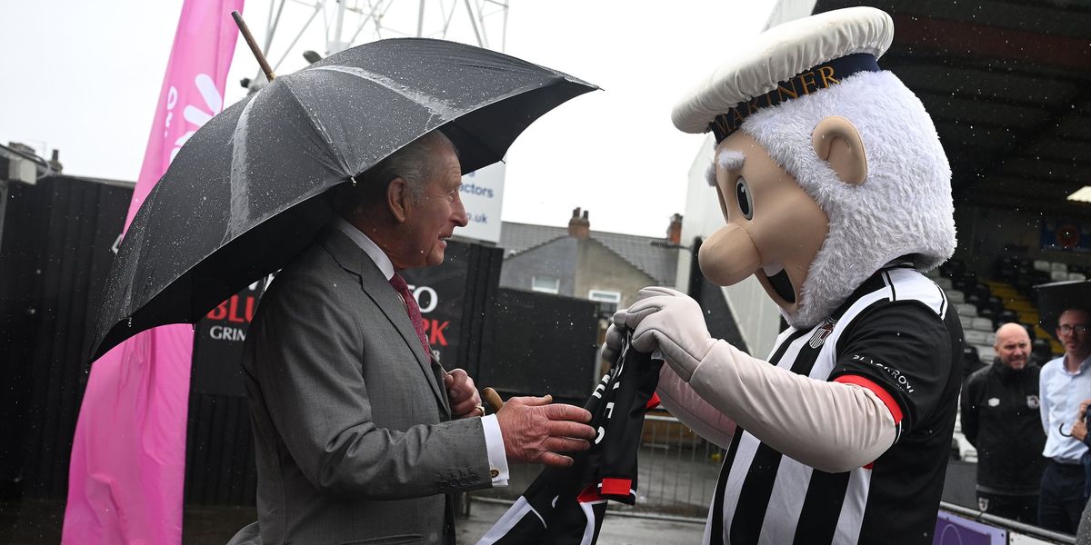 King Charles delighted as he is receives personalised football shirt from club mascot King Charles delighted as he is receives personalised football shirt from club mascot