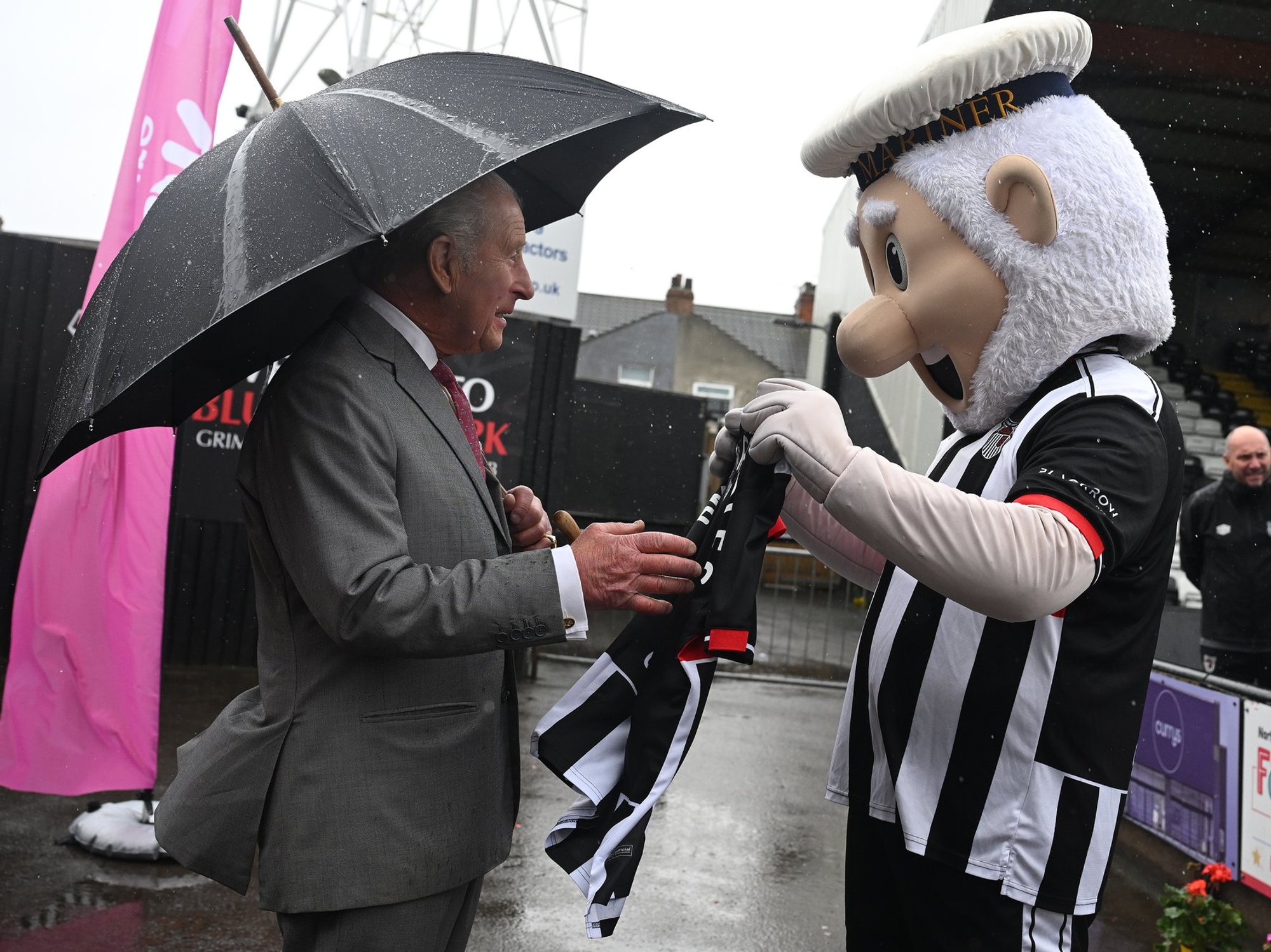 King Charles delighted as he is presented with personalised football shirt from club mascot