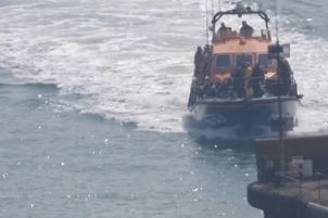 WATCH: Rescued migrants arrive on UK shores after dramatic race against the tide