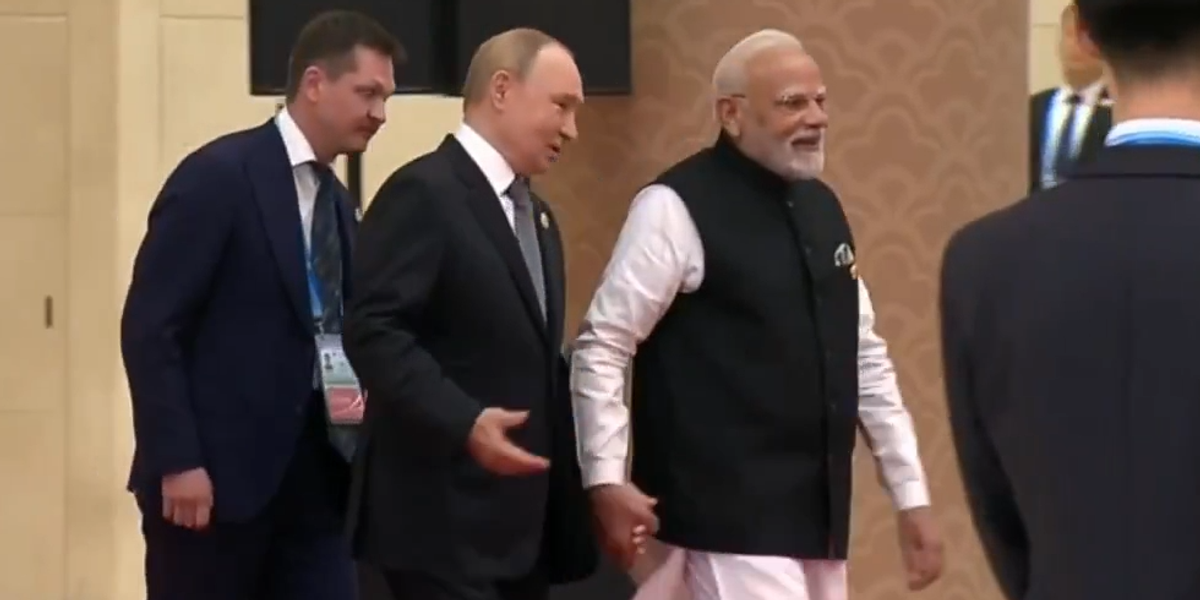 NextImg:WATCH: Bizarre moment Vladimir Putin holds hands with Narendra Modi at anti-Nato summit