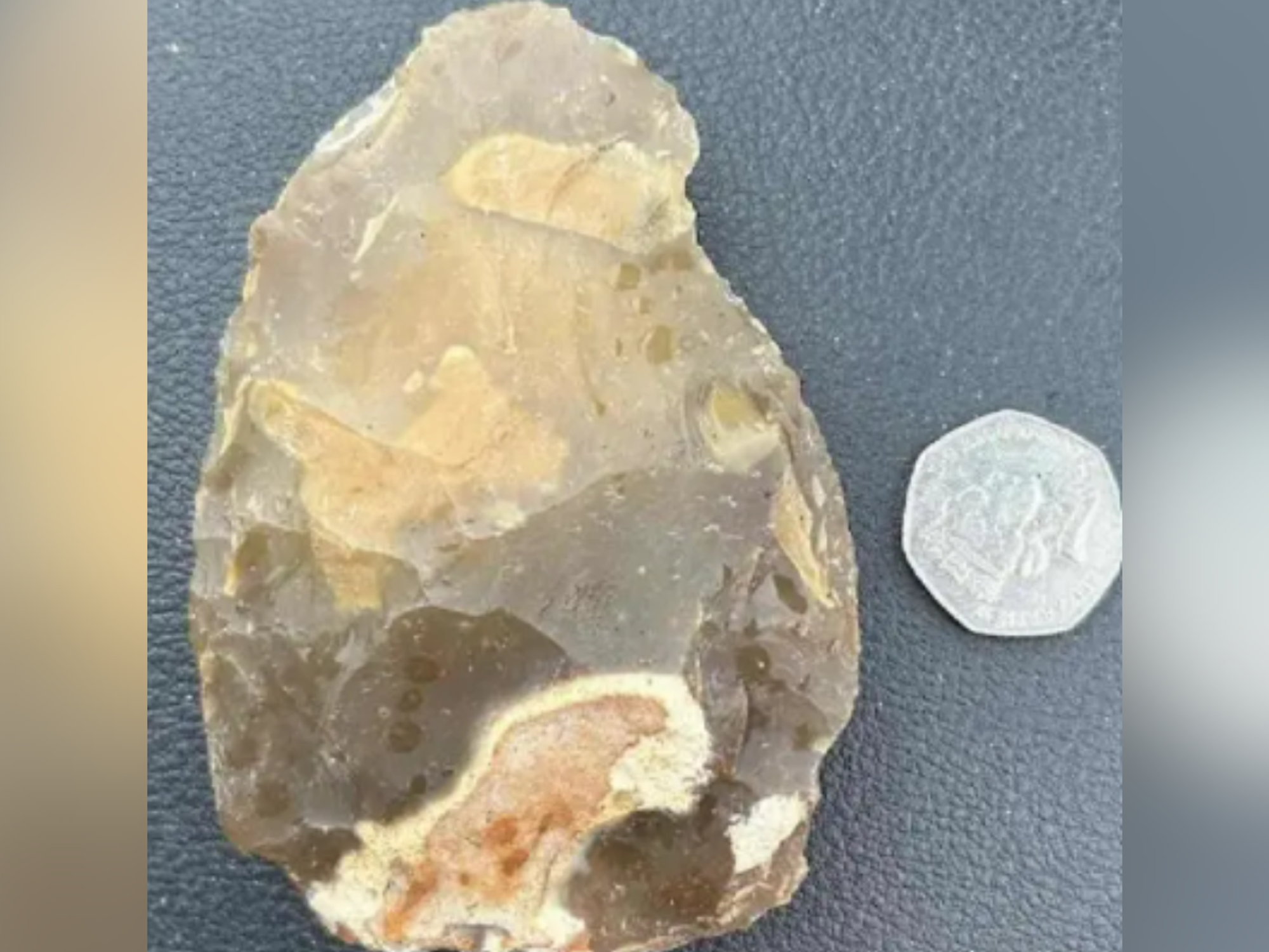 Family left stunned after stumbling across 'exceedingly rare' Stone Age hand axe