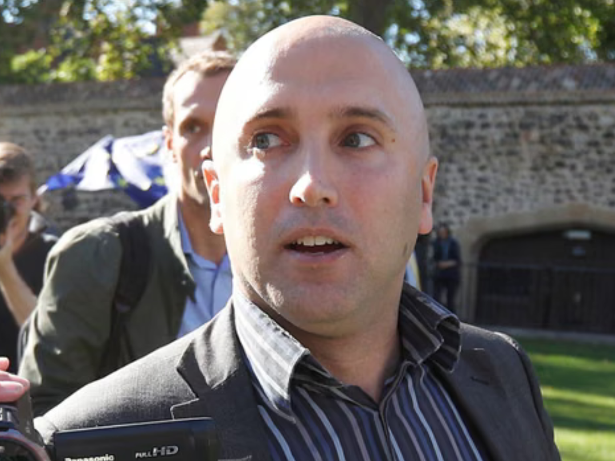 British 'Kremlin mouthpiece' faces Met Police war crimes probe after filming sick videos in Ukraine