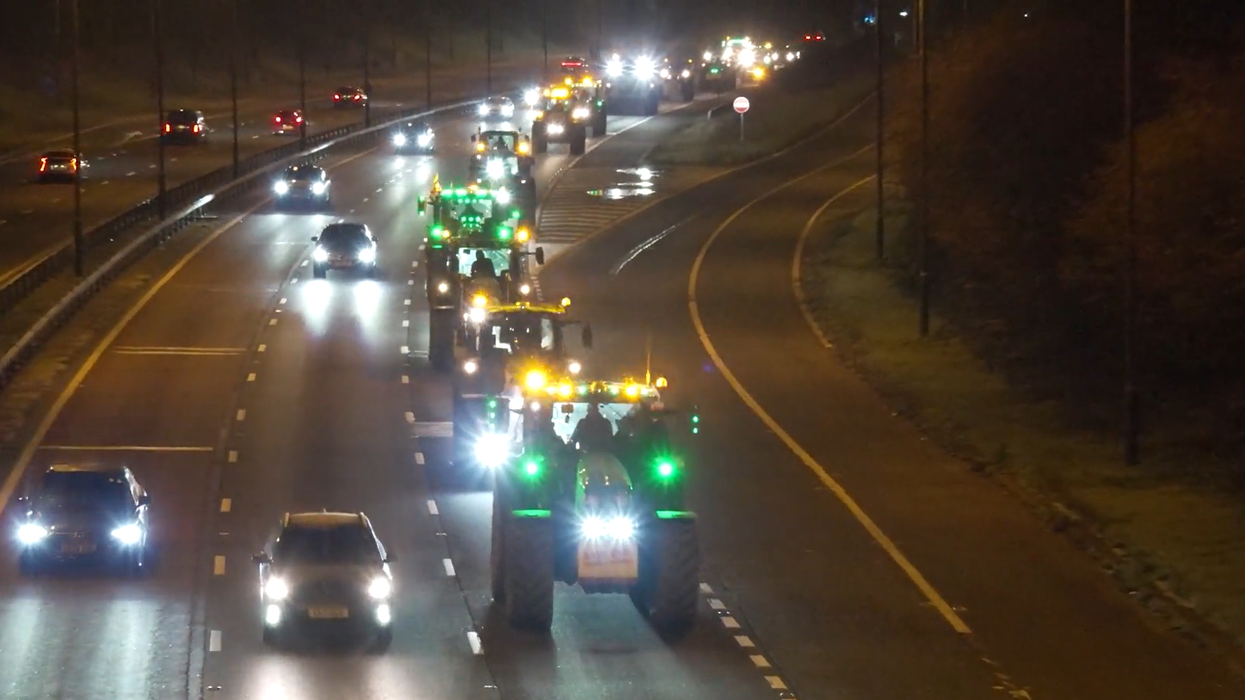 Watch as columns of tractors roll down M4 as fu...
