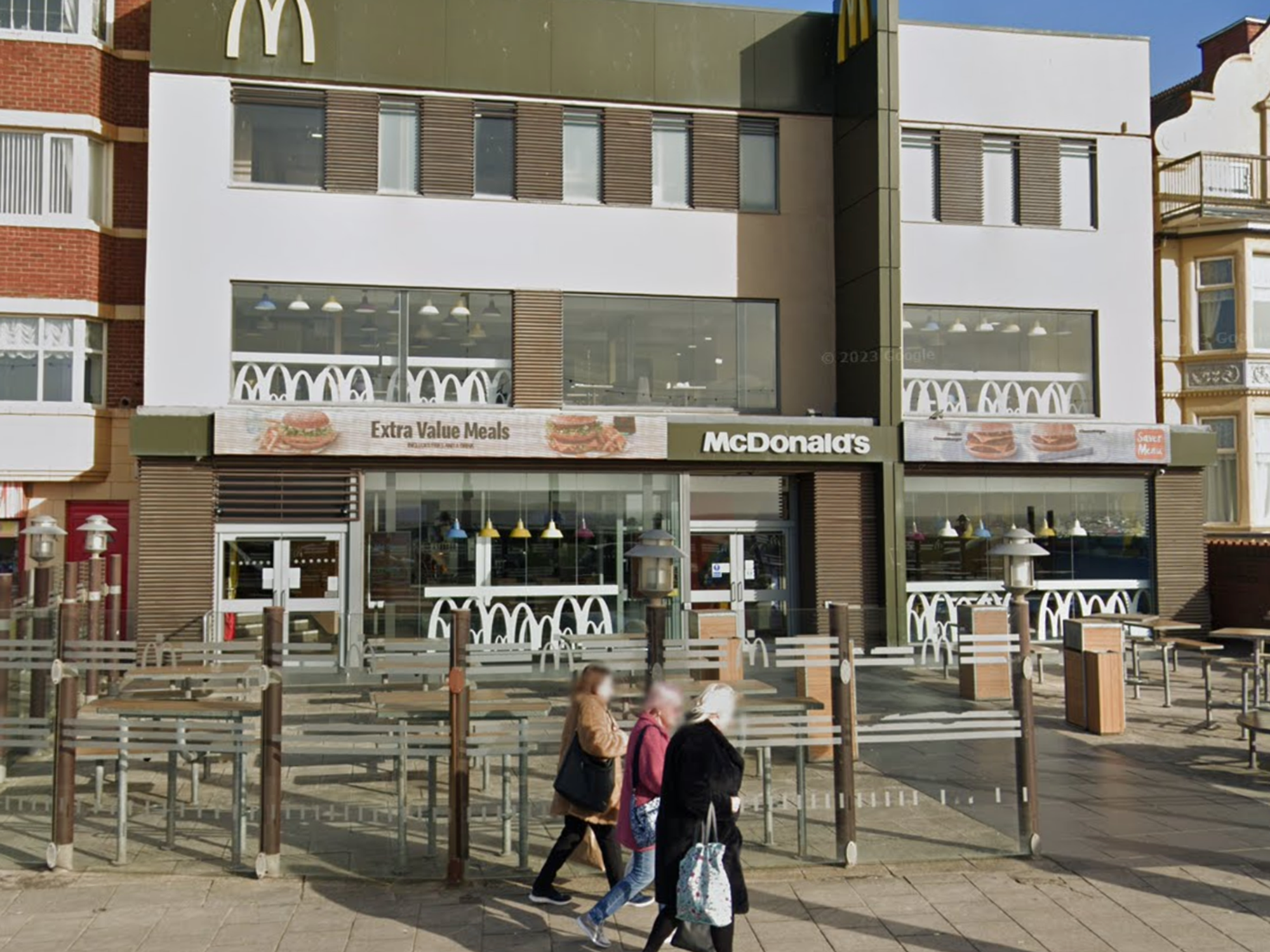 Police rush to McDonald's in iconic seaside town after man stabbed