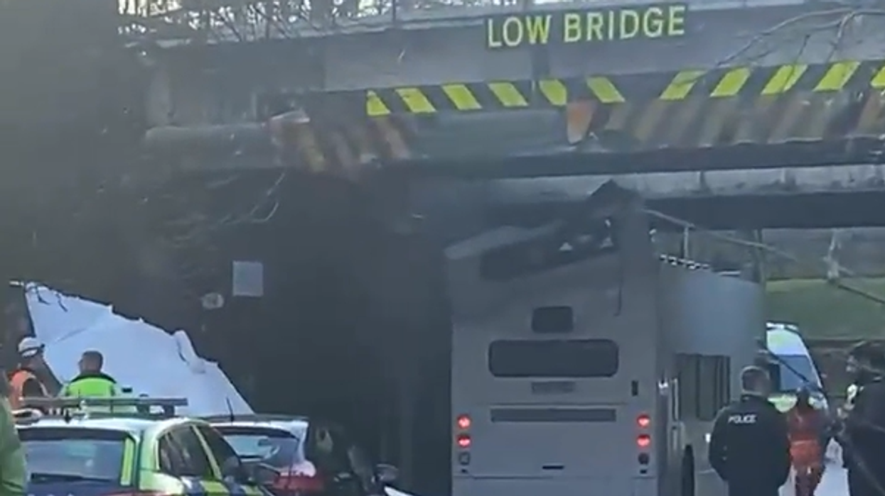 Multiple children injured as bus roof ripped off after horror crash into bridge