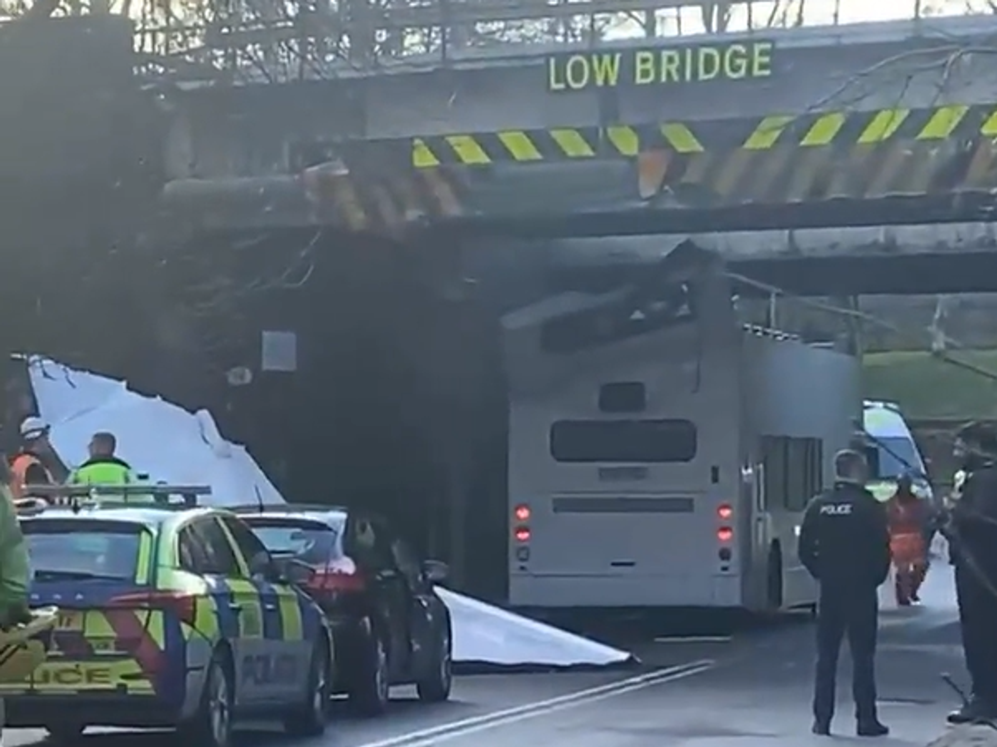 Multiple children injured as bus roof ripped off after horror crash into bridge