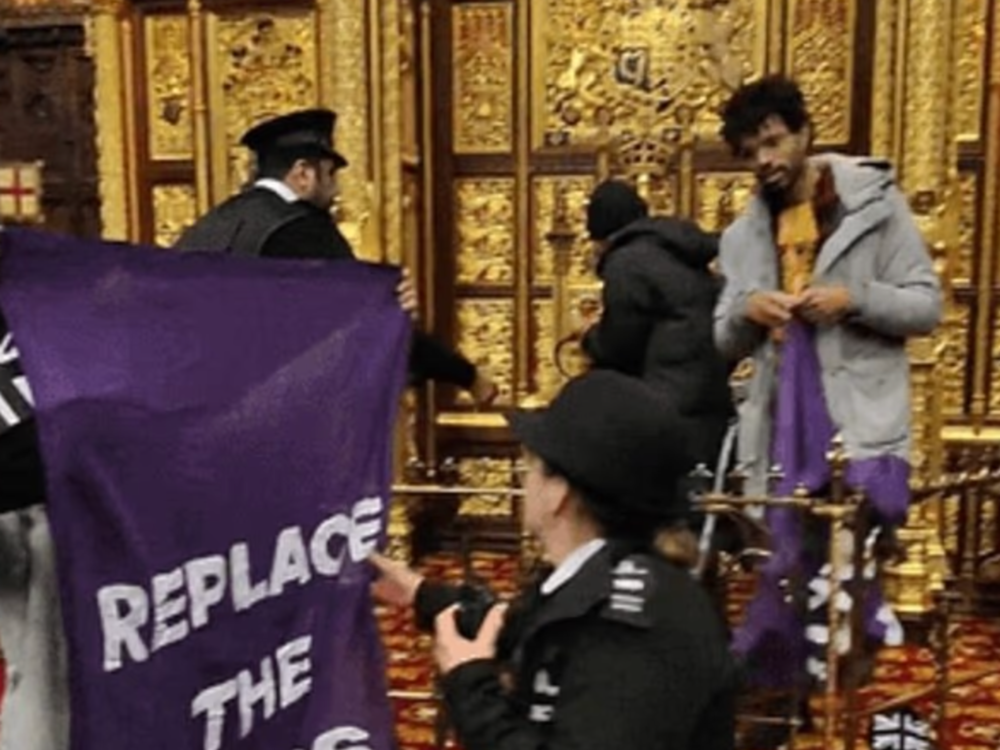 Left-wing protesters storm House of Lords barriers and target King's throne during protest