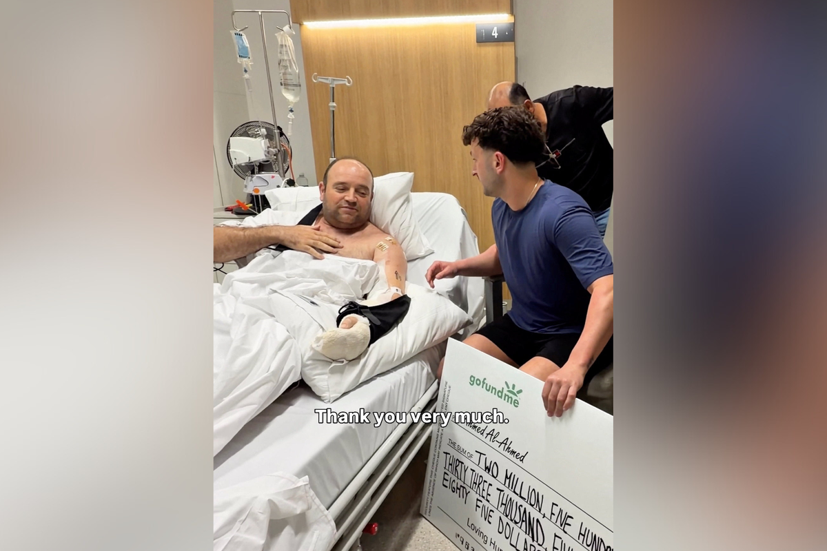 Bondi beach hero shocked as he receives $2.5MILLION cheque in hospital bed: 'I deserve it?'