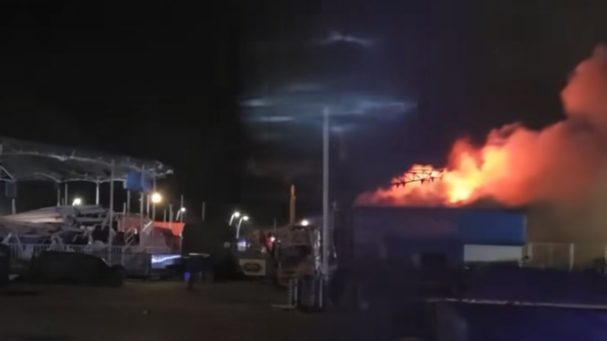 Huge fire engulfs seaside amusement park as firefighters work through the night to tackle blaze