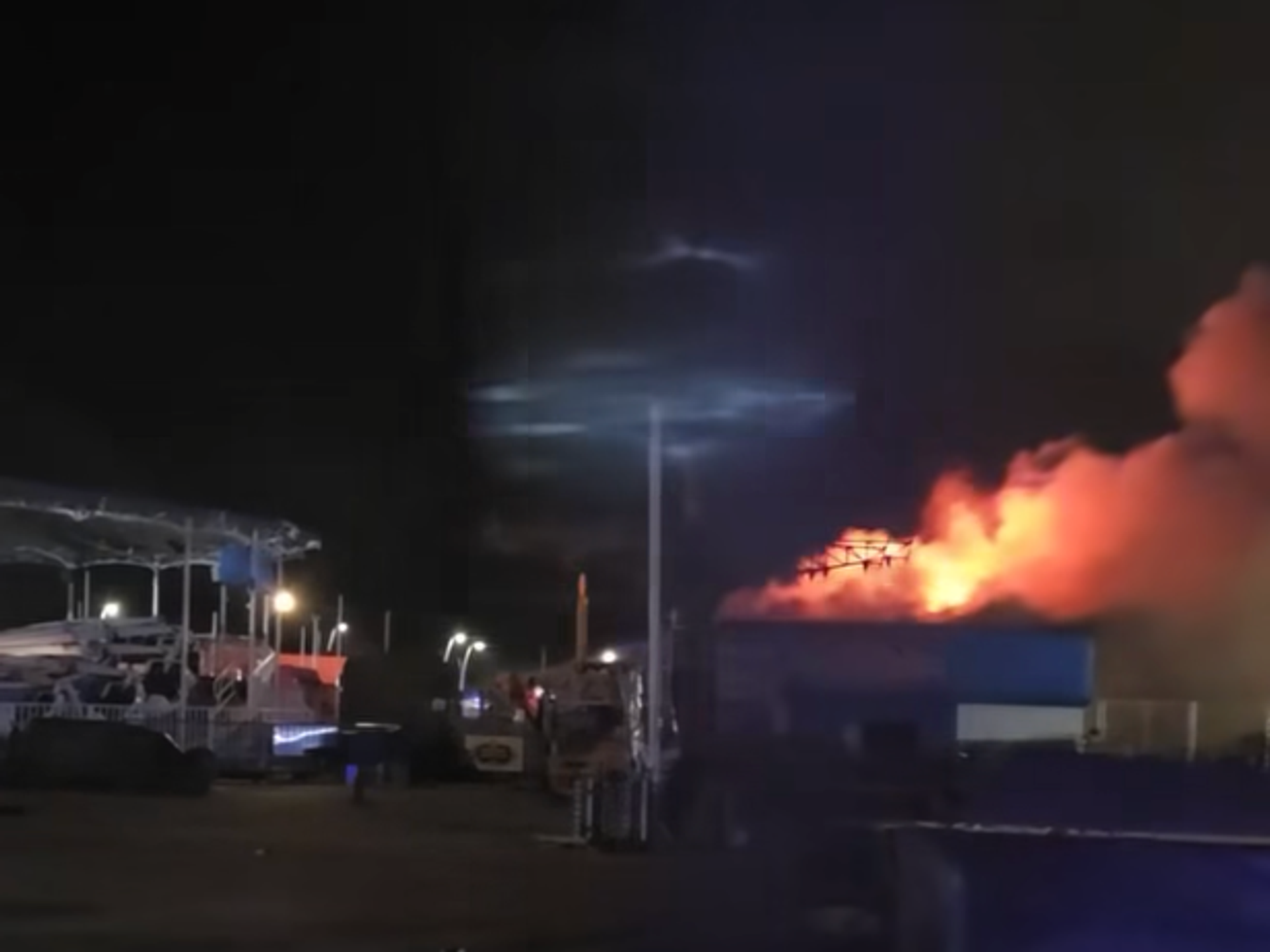 Huge fire engulfs seaside amusement park as firefighters work through the night to tackle blaze