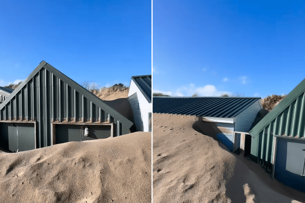 Beach huts on one of Britain's most exclusive holiday hotpots buried under huge mountains of sand