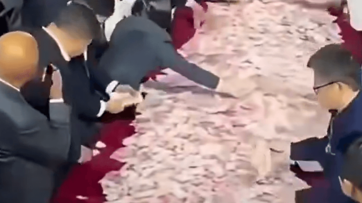 Chinese company lays out £19MILLION in cash bonus at end of year party for employees