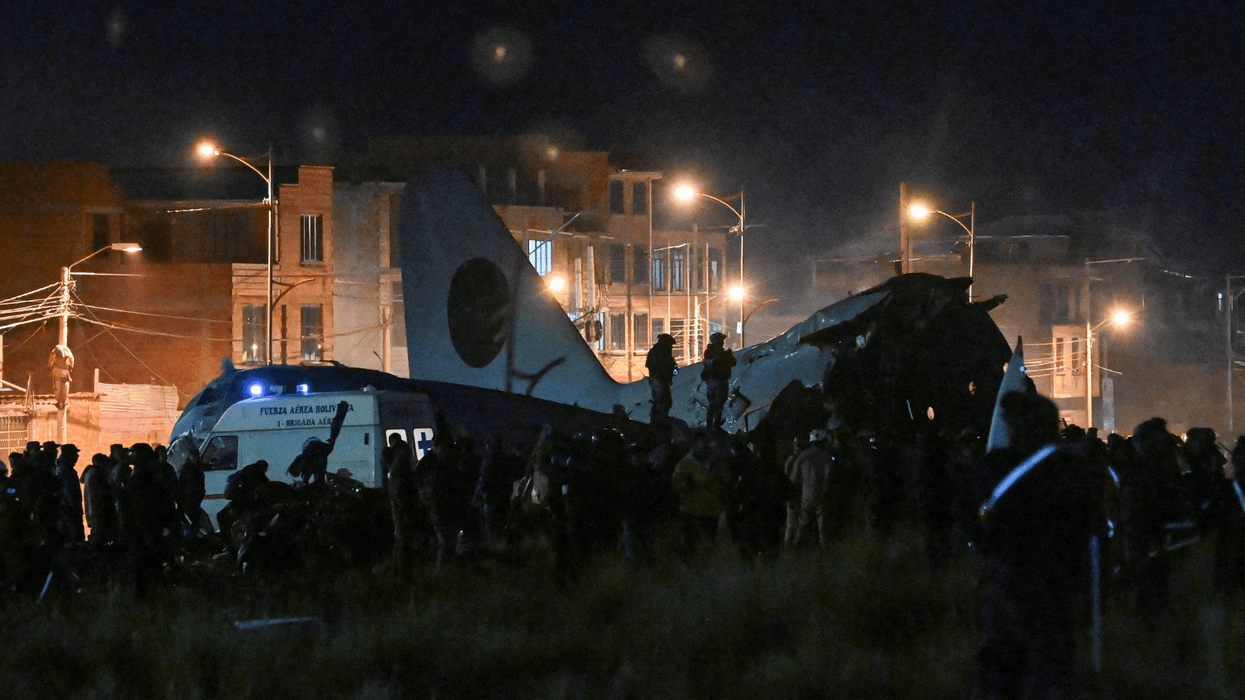 At least 15 dead after plane packed with banknotes crashes onto motorway in Bolivia