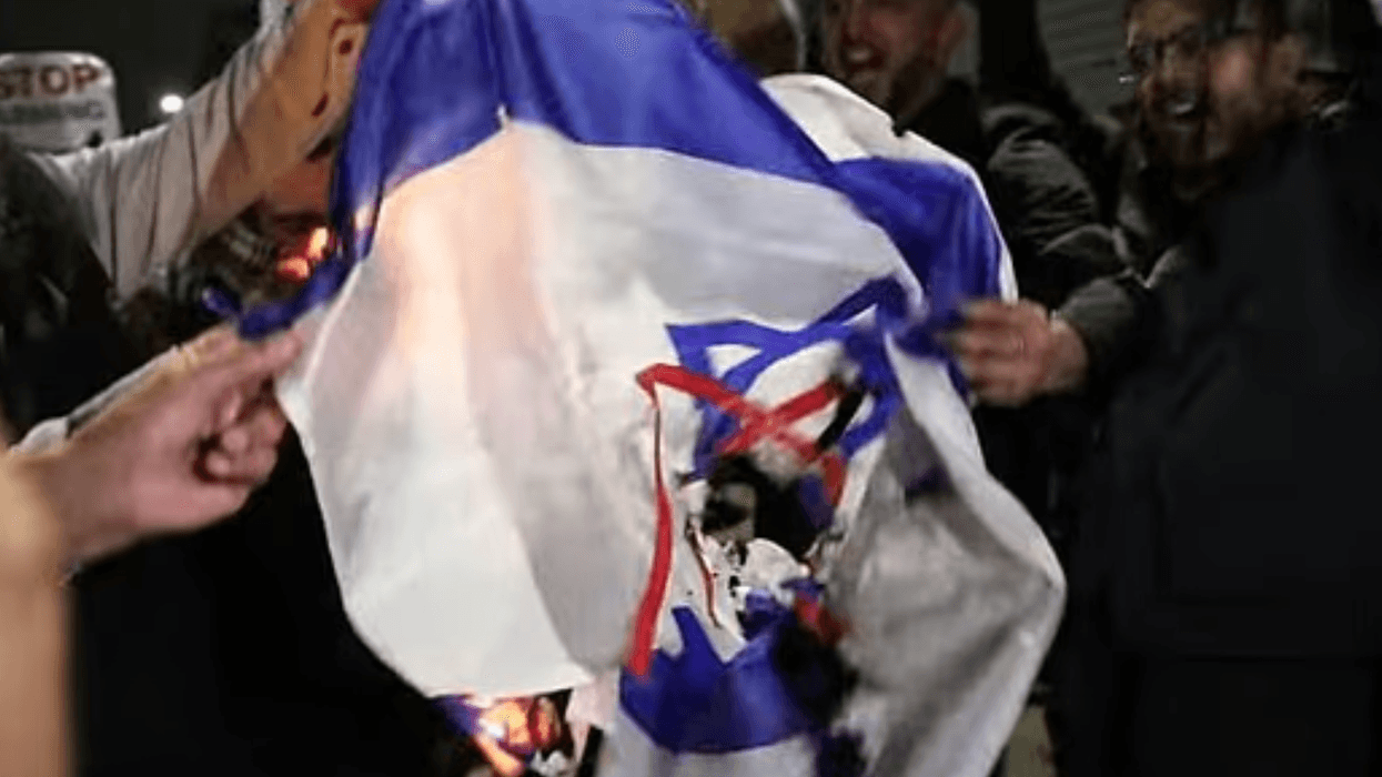 Protesters burn Israeli flag at pro-Ayatollah vigil in Birmingham while chanting 'death to the IDF'