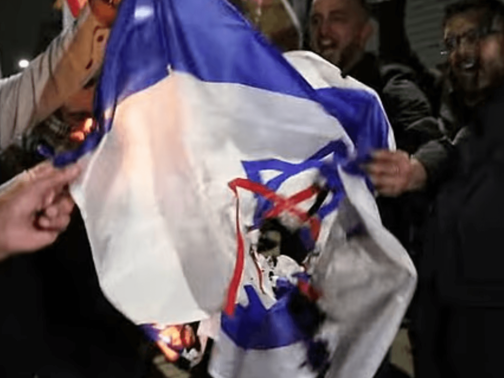 Protesters burn Israeli flag at pro-Ayatollah vigil in Birmingham while chanting 'death to the IDF'