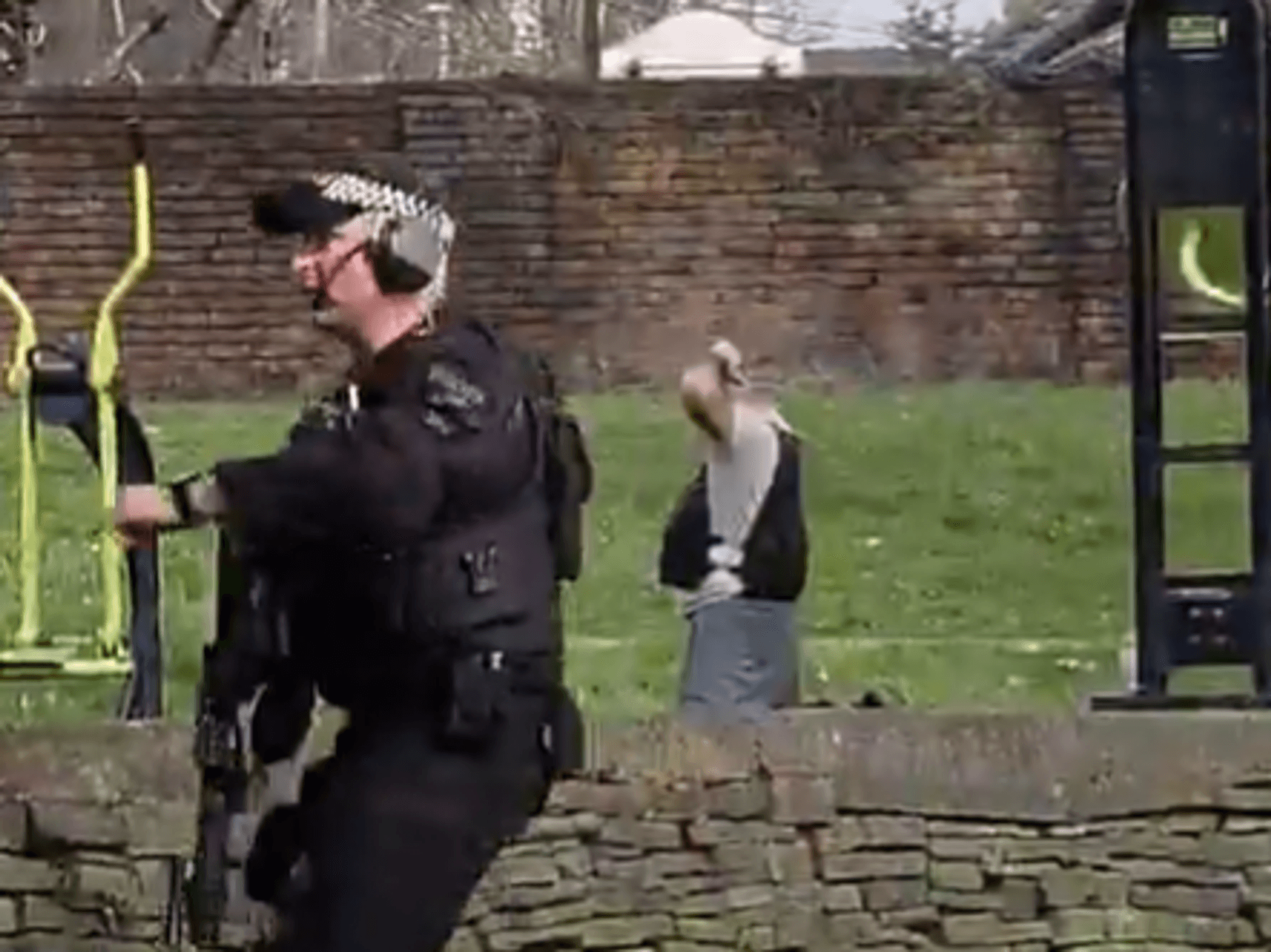 Armed police swarm Manchester park after man seen wearing 'suicide vest'... but the reality is no...
