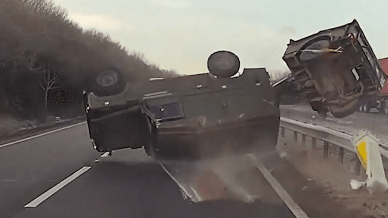 Two soldiers injured after military Land Rover and trailer flips over dual carriageway in horror crash