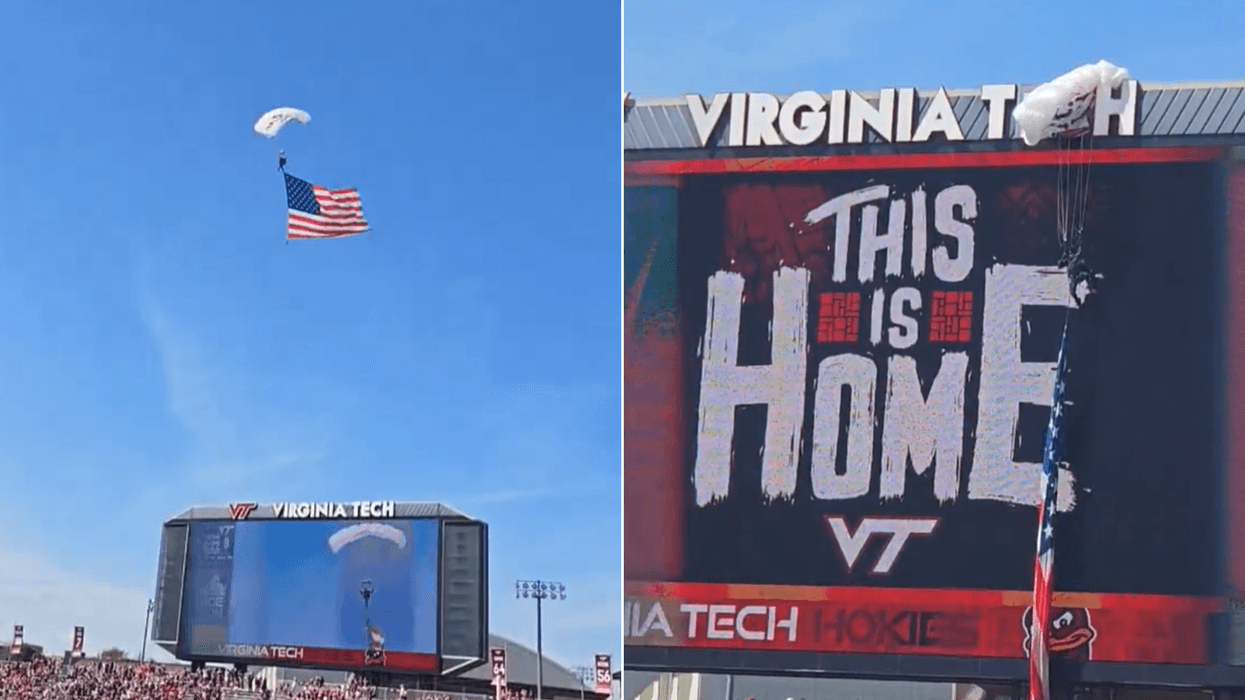 Parachuter CRASHES into scoreboard — delaying game for over an hour