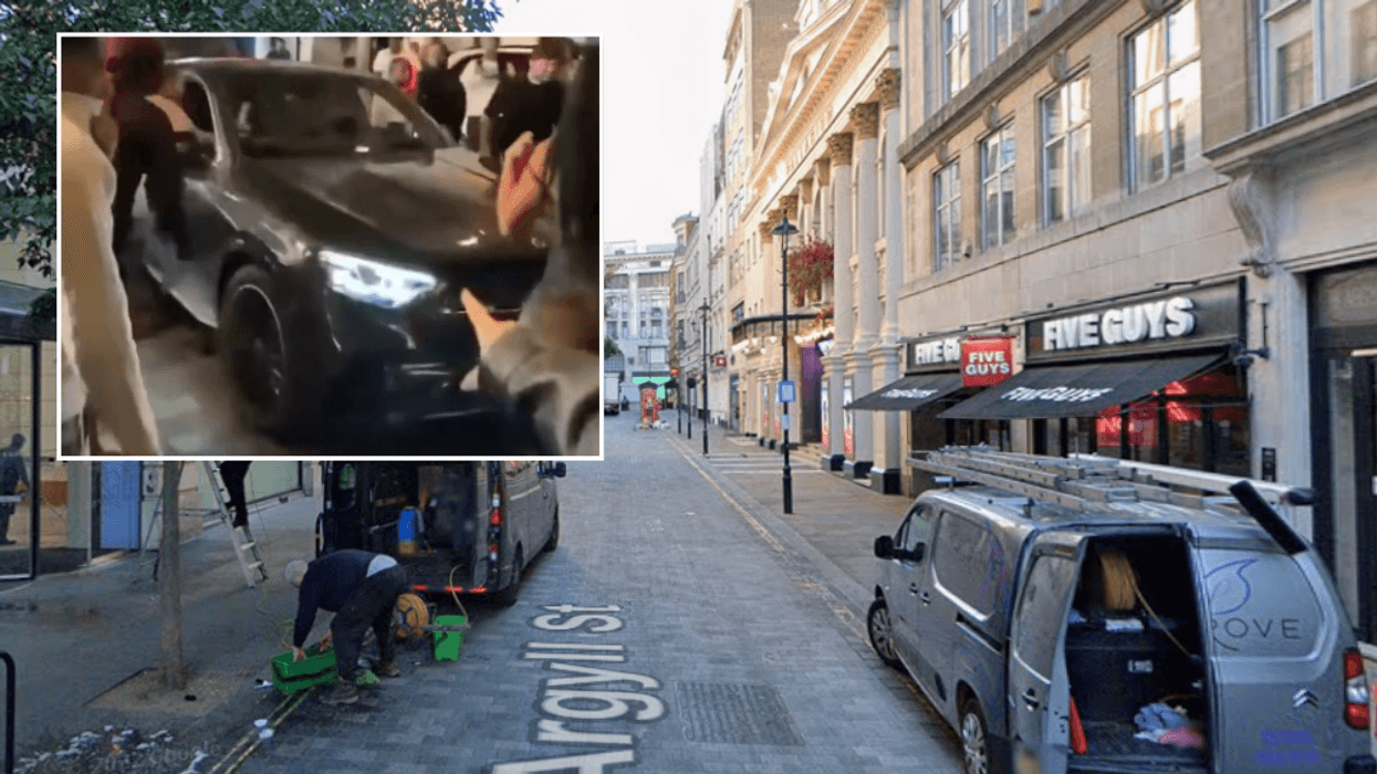 Three people injured after car ploughs into central London crowds as police arrest woman