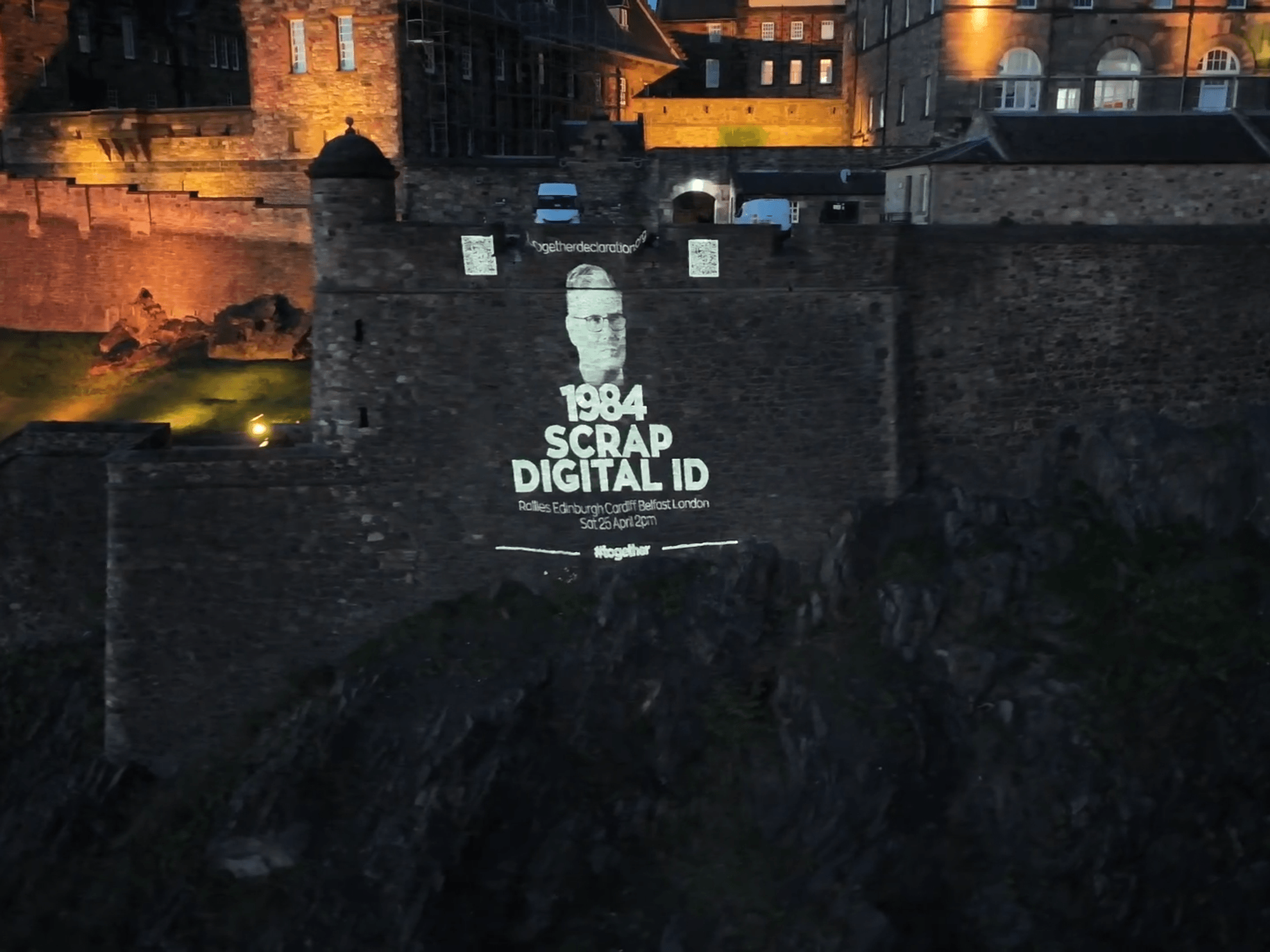 Massive anti-digital ID display projected onto historic Scottish landmark