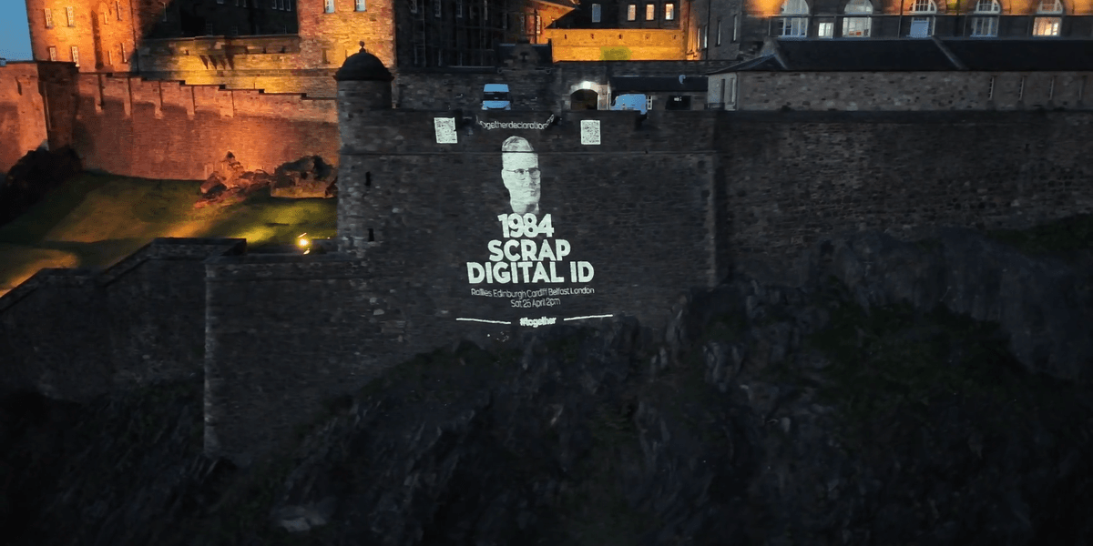 Massive anti-digital ID display projected onto historic Scottish landmark Massive anti-digital ID display projected onto historic Scottish landmark
