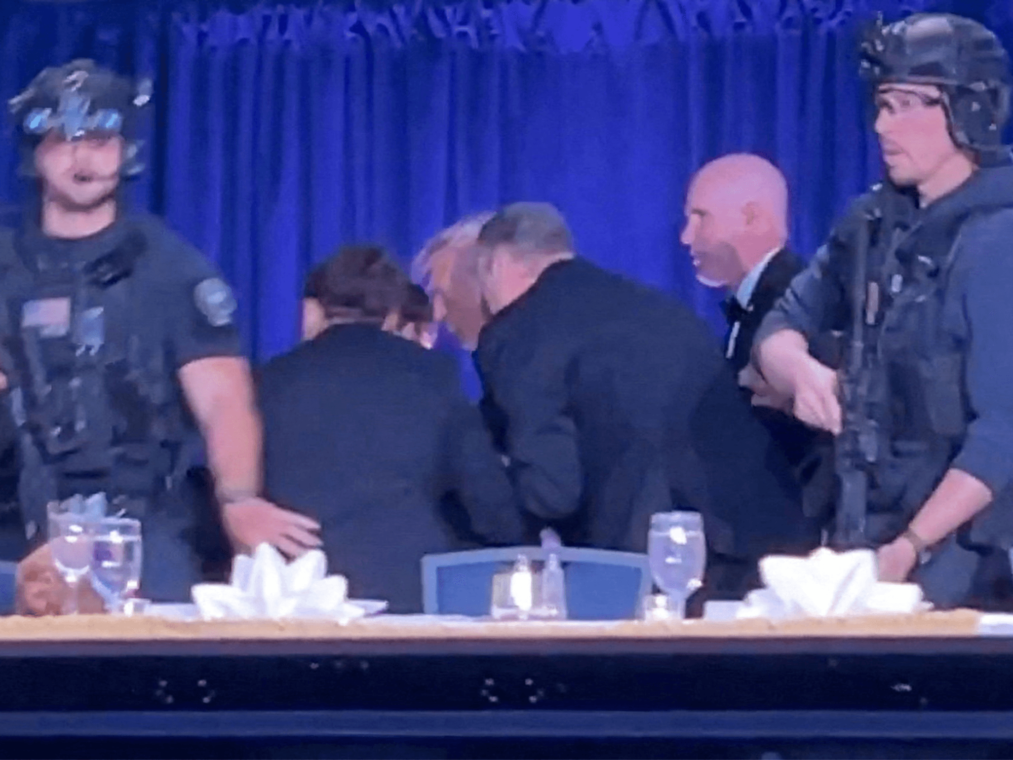 Donald Trump bundled out by Secret Service agents as shots fired at White House event