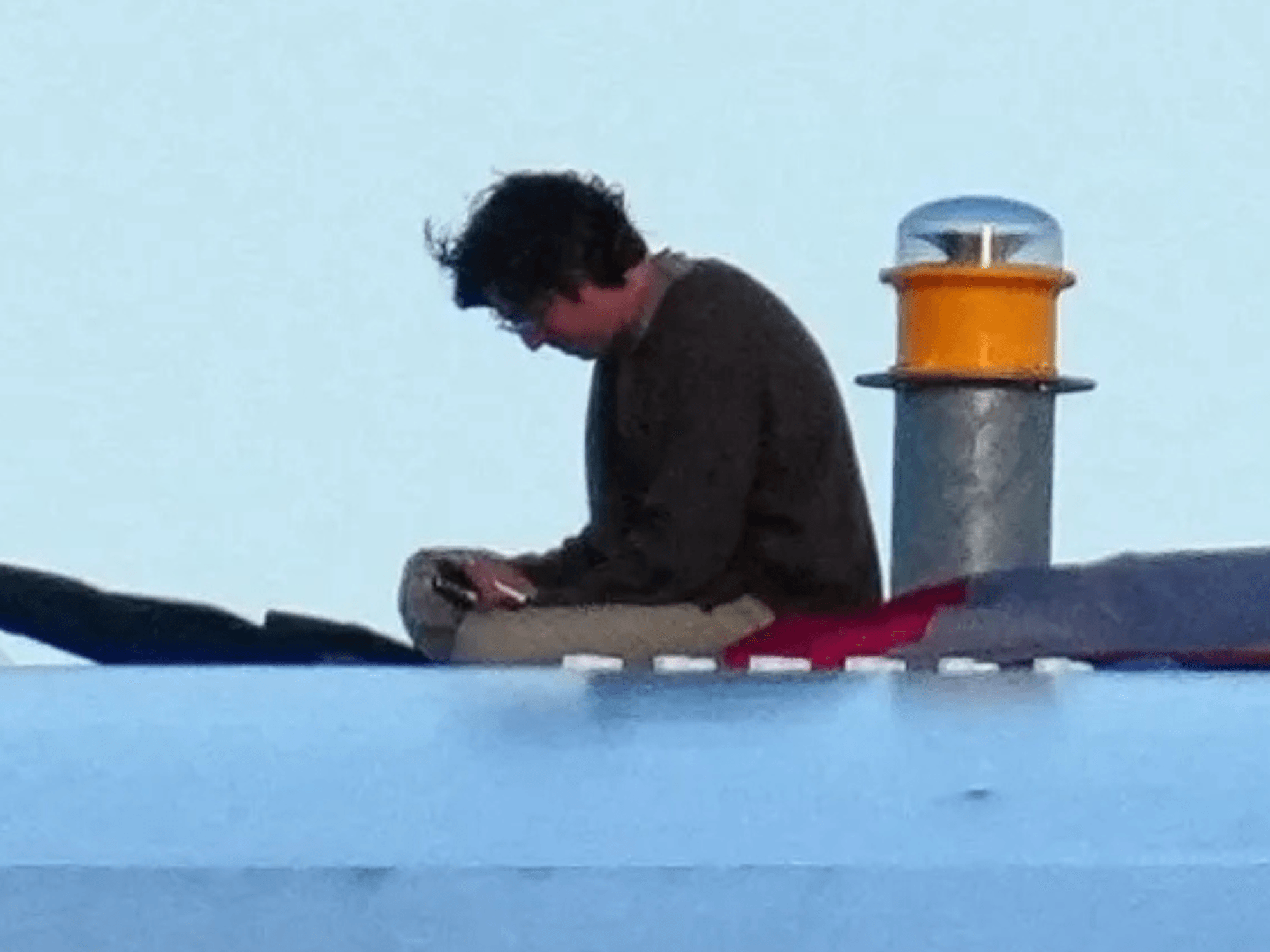 Activist climbs and occupies Washington bridge for FOUR DAYS in protest against Iran war