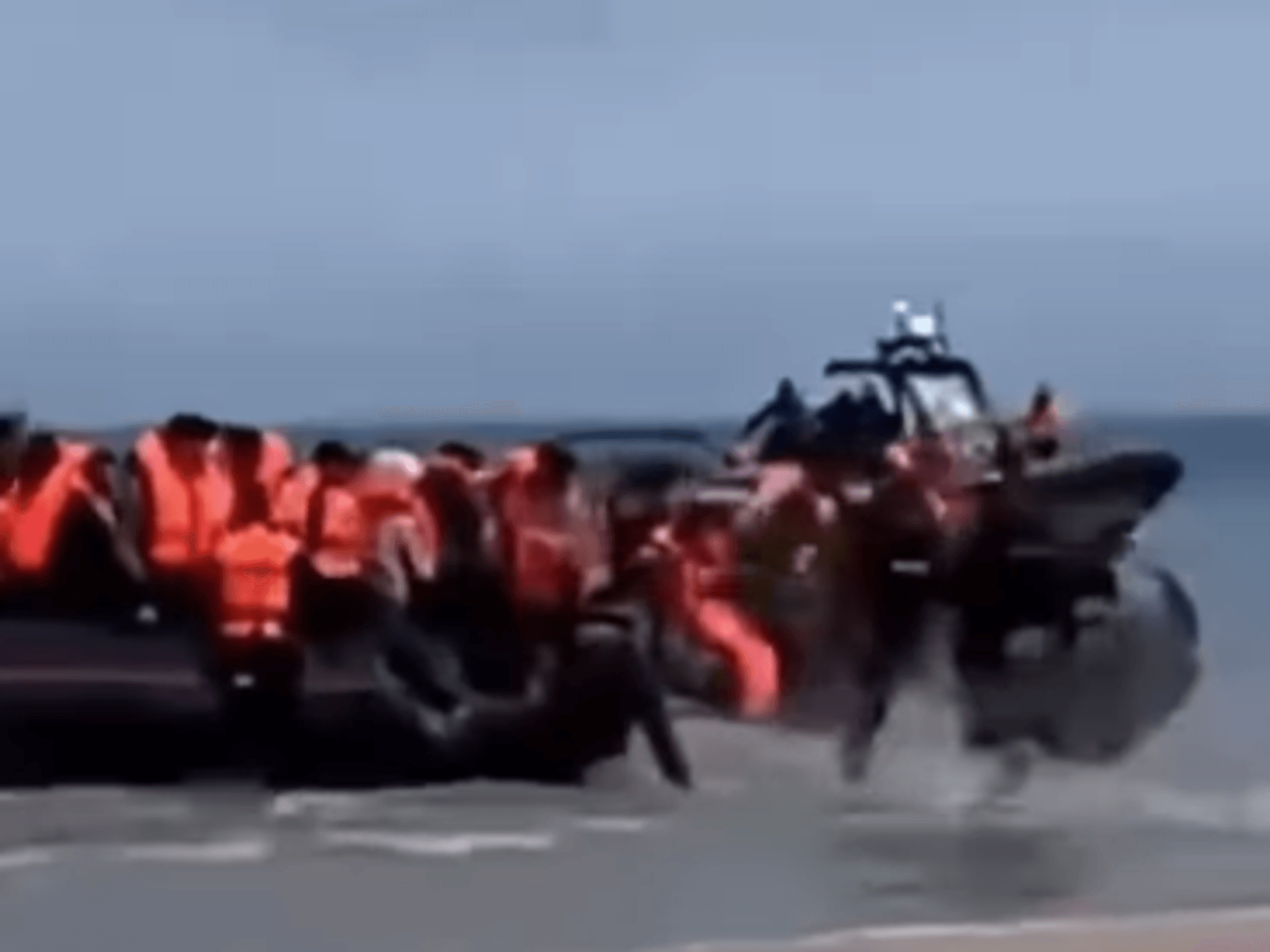 French police face human rights probe for popping inflatable migrant boat - while it was still on...
