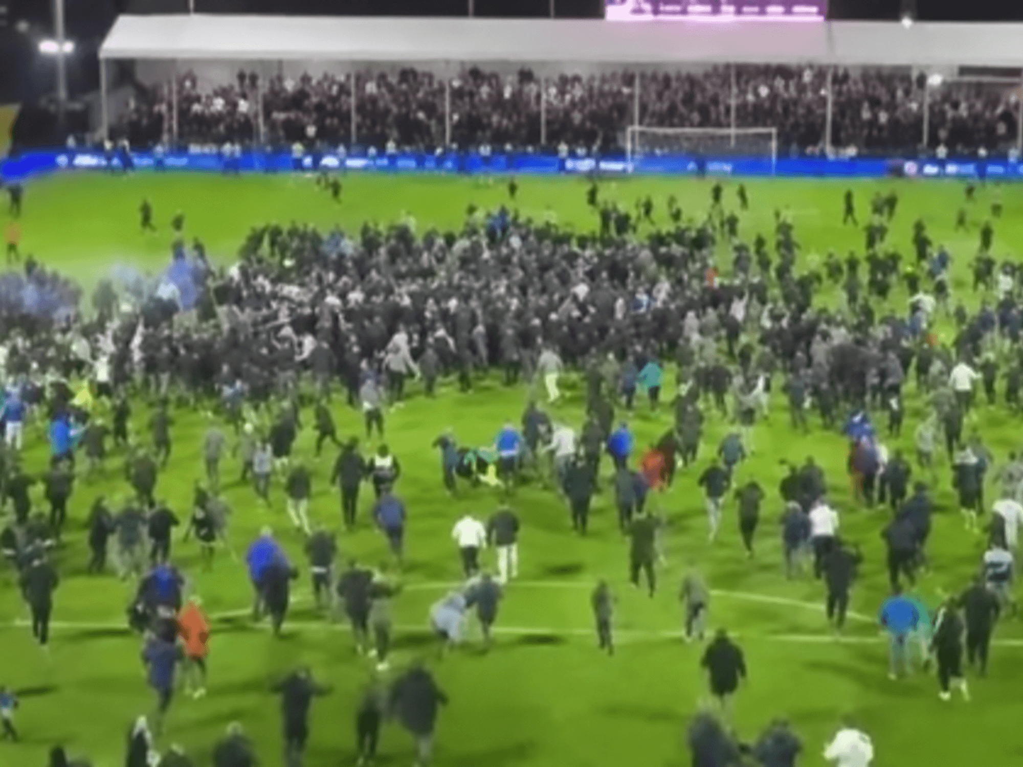 EFL goalkeeper tackled by rival supporter in shocking incident after play-off heartbreak