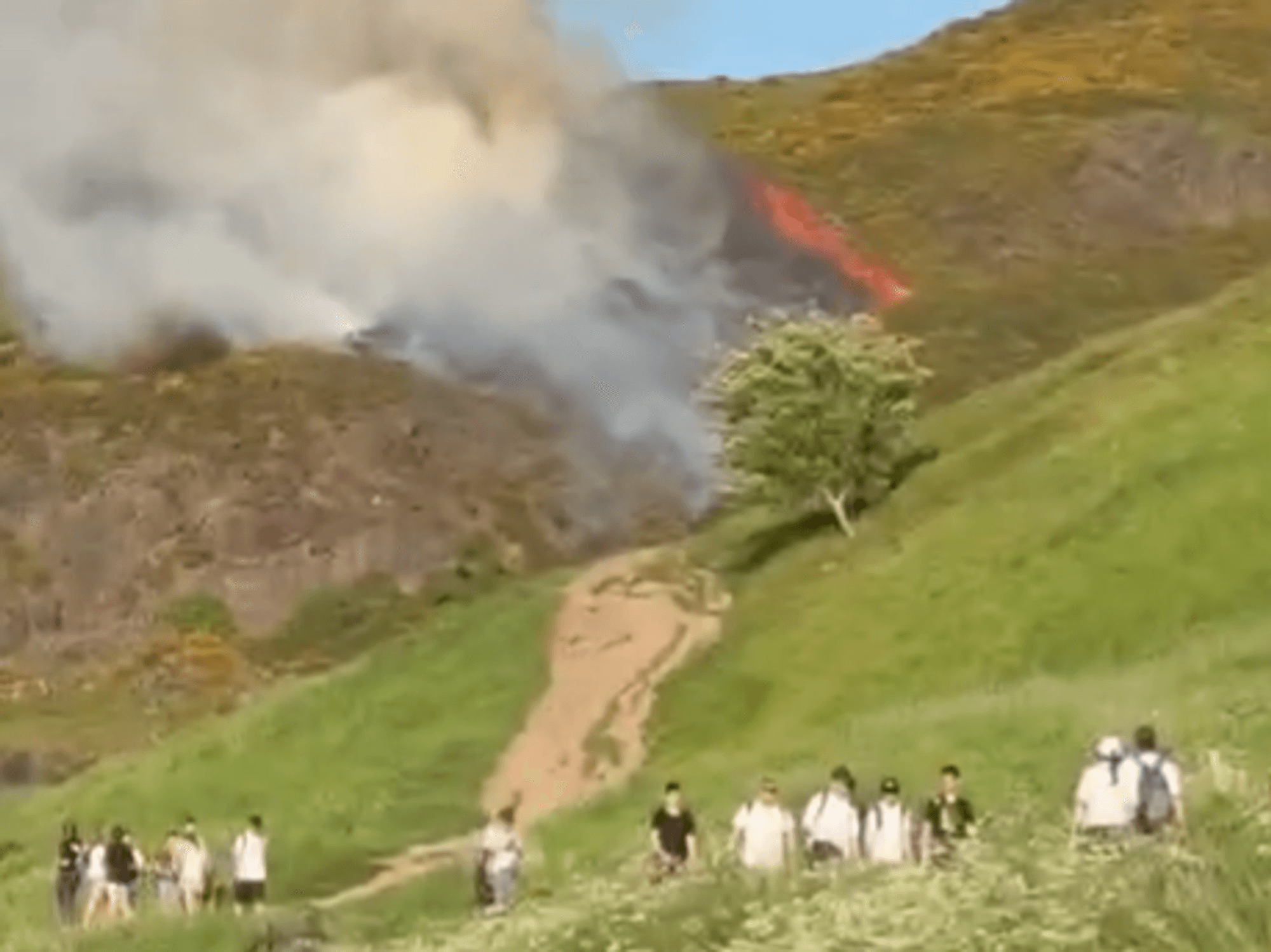 Hikers flee iconic British landmark as emergency services tackle huge wildfire