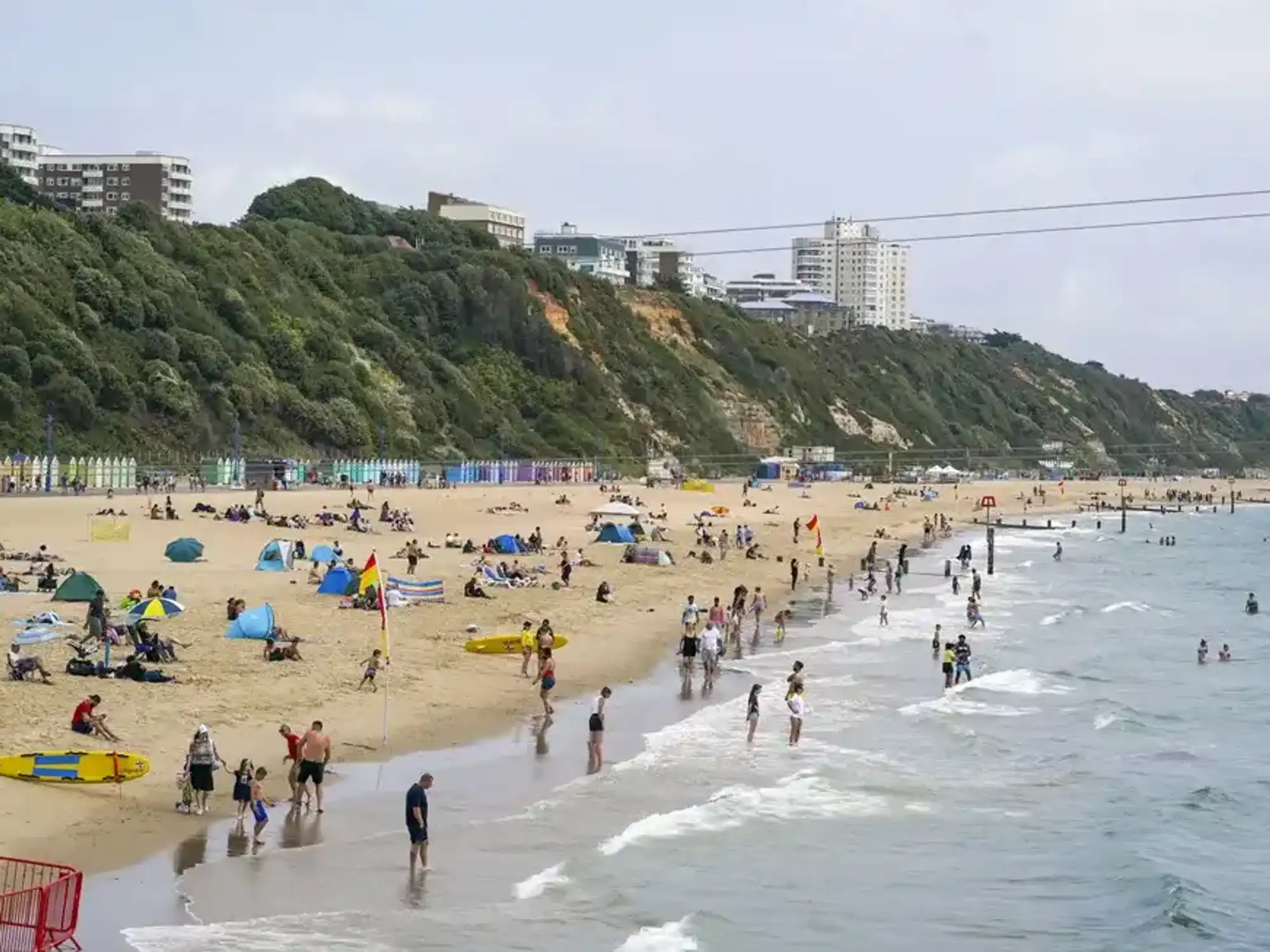Mysterious 'encampment' appears on popular South Coast beach just yards from migrant hotel