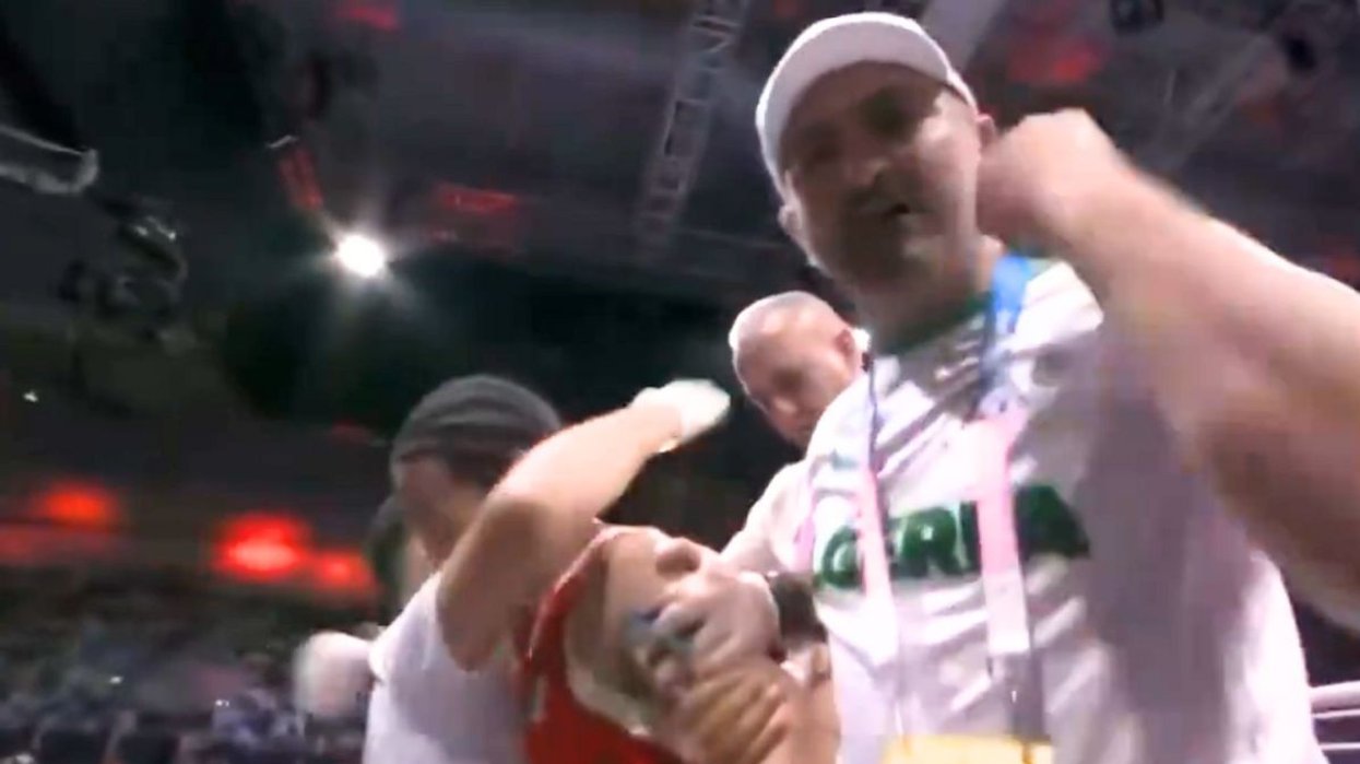 Imane Khelif's coach celebrated to the camera