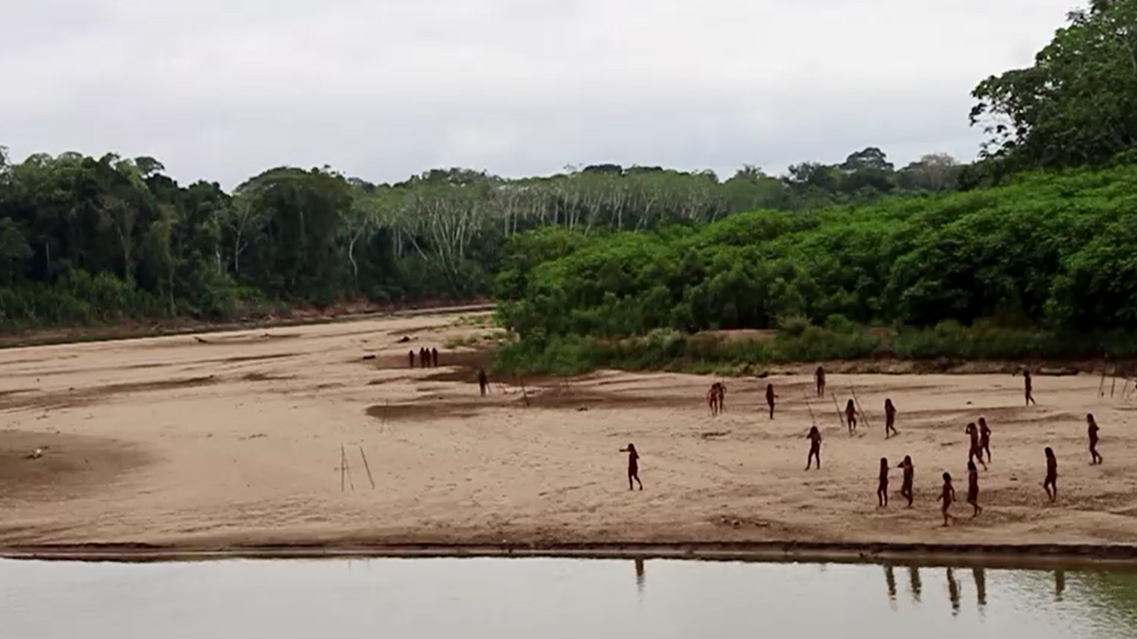  Indigenous people of the Mascho Piro tribe at riverbank