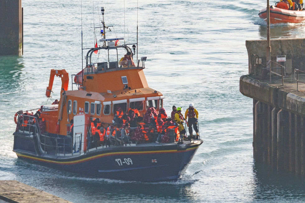 Individuals believed to be migrants arriving in Dover on December 17