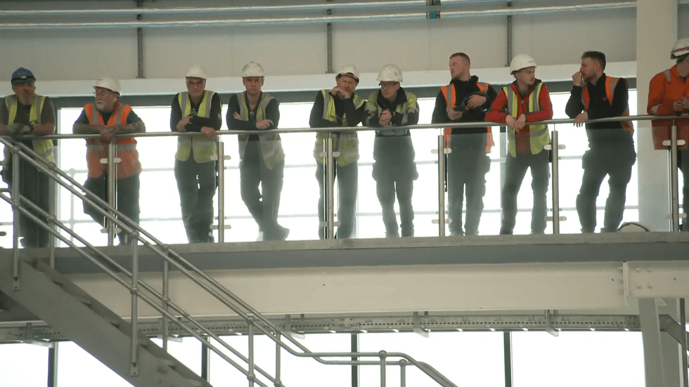Industry workers watch on ahead of Keir Starmer's speech